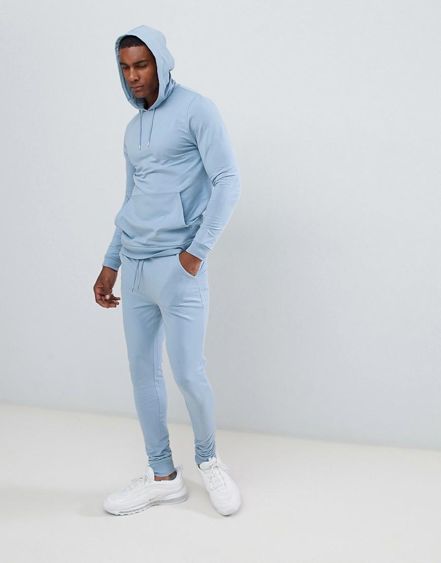 Tuta azzurra con felpa attillata con cappuccio e joggers super skinnyASOS  in Cotone da Uomo colore Blu | Lyst
