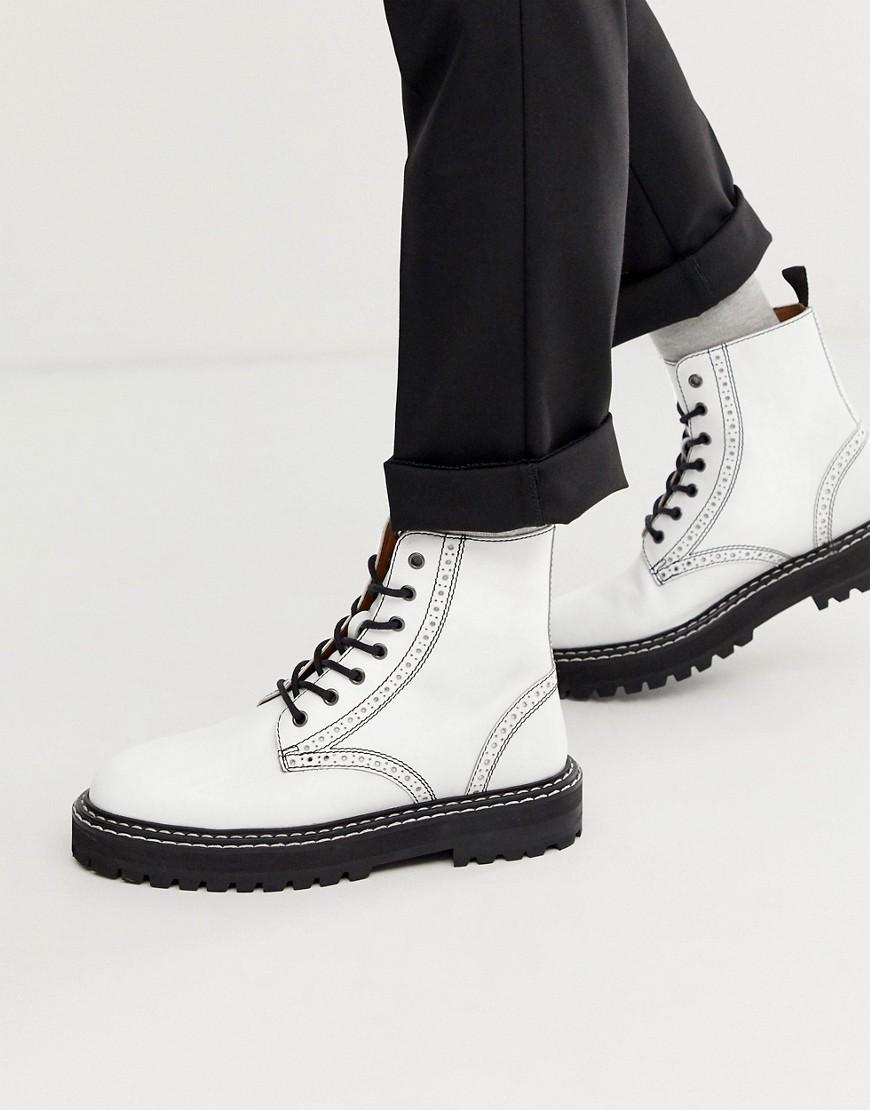 white boots with black sole