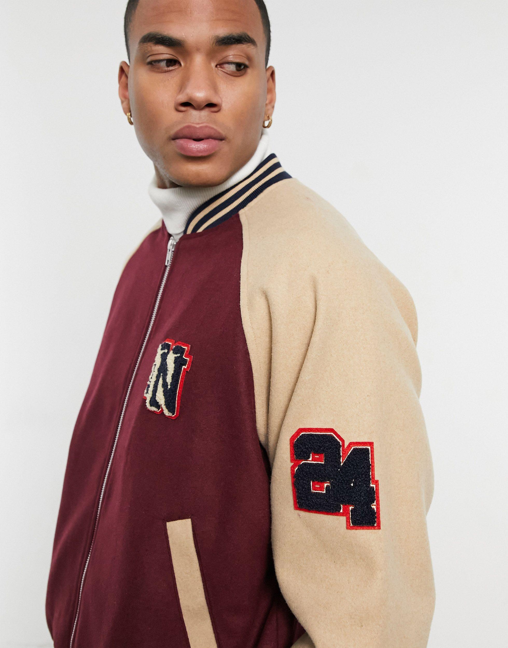 ASOS DESIGN faux leather varsity jacket with embroidery in brown