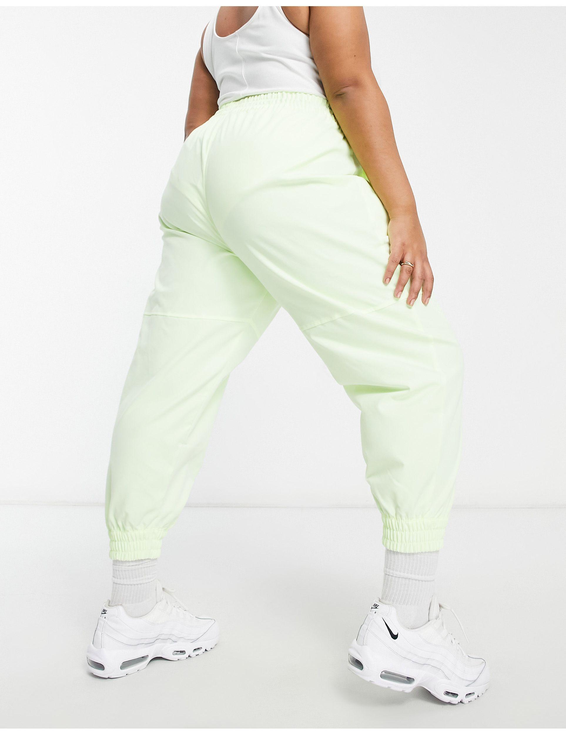 Plus - pantalon tissé à logo virgule - fluo Nike en coloris Jaune | Lyst