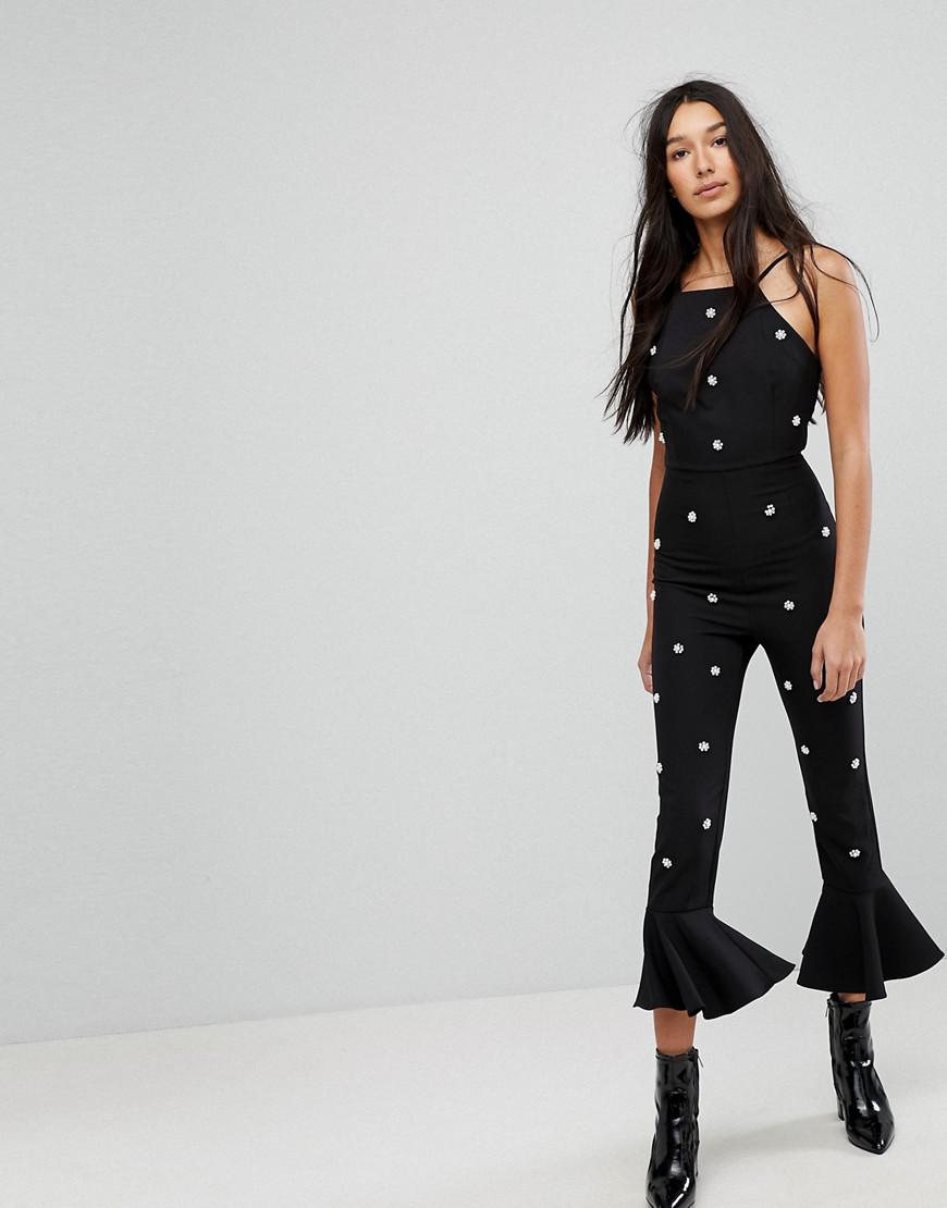 black jumpsuit with pearls