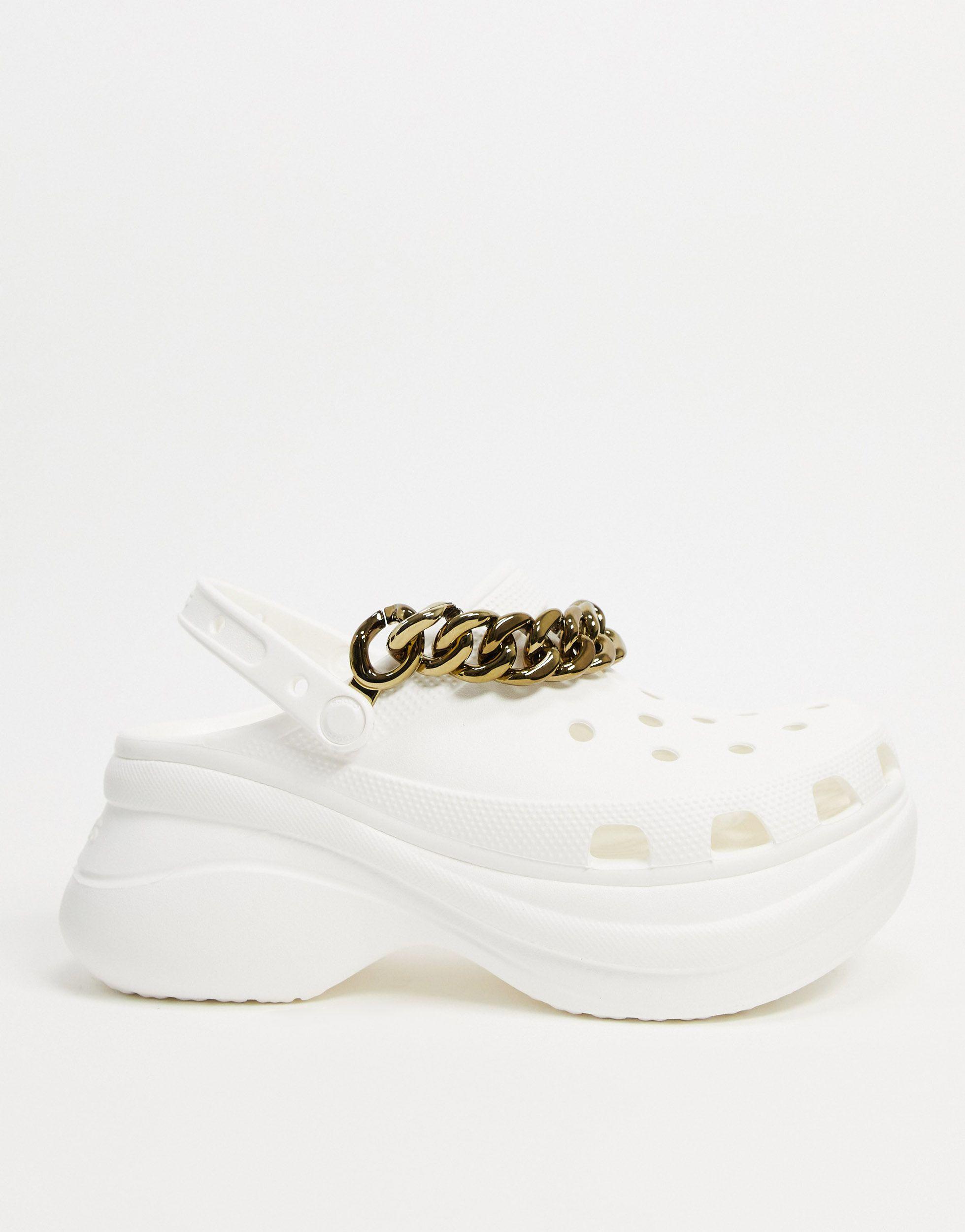 A pair of Crocs and a trendy chain that can be easily attached for