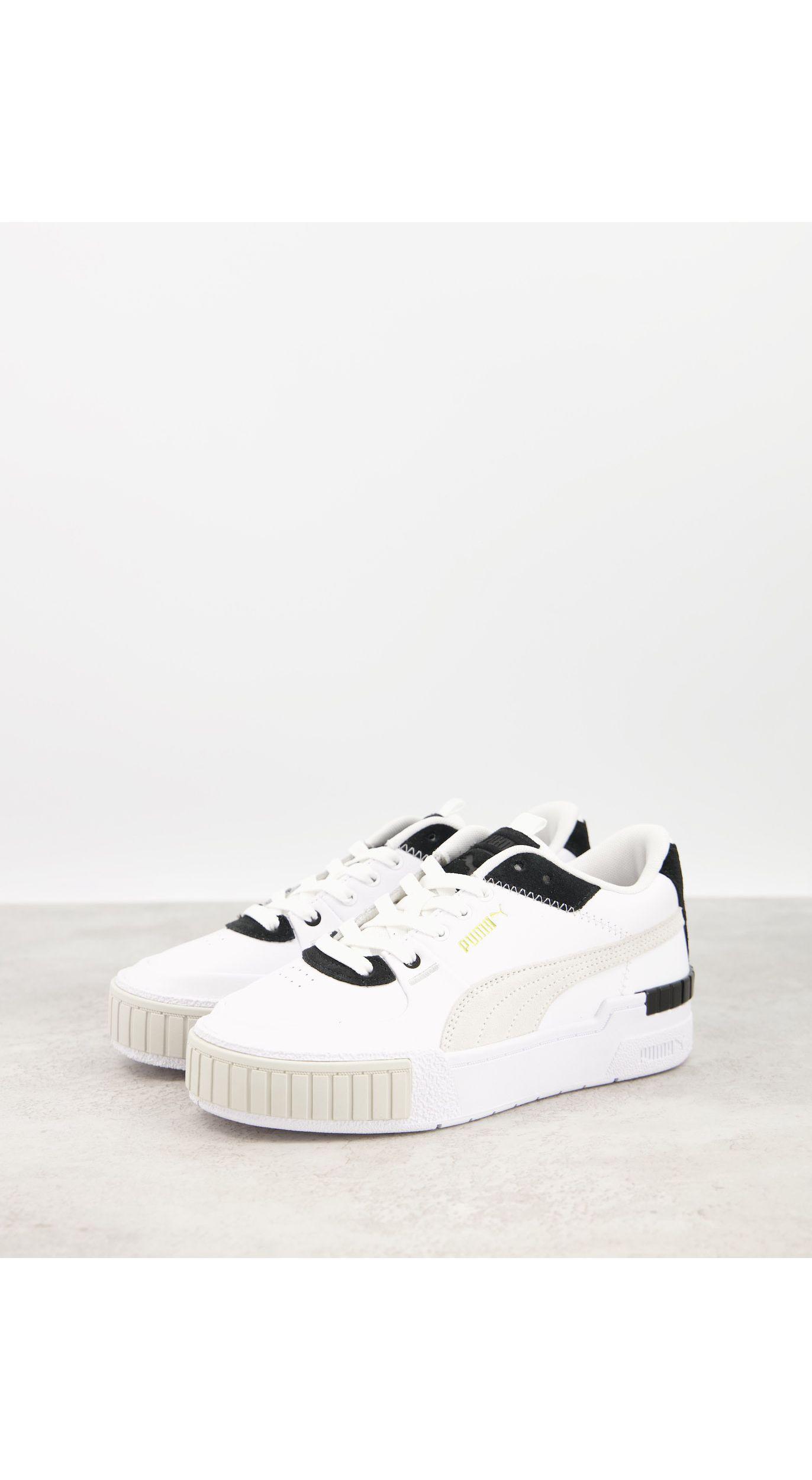 ▷ Puma - Cilia - Sneakers met dikke zool in wit en goud | ASOS Sale | 25%  korting