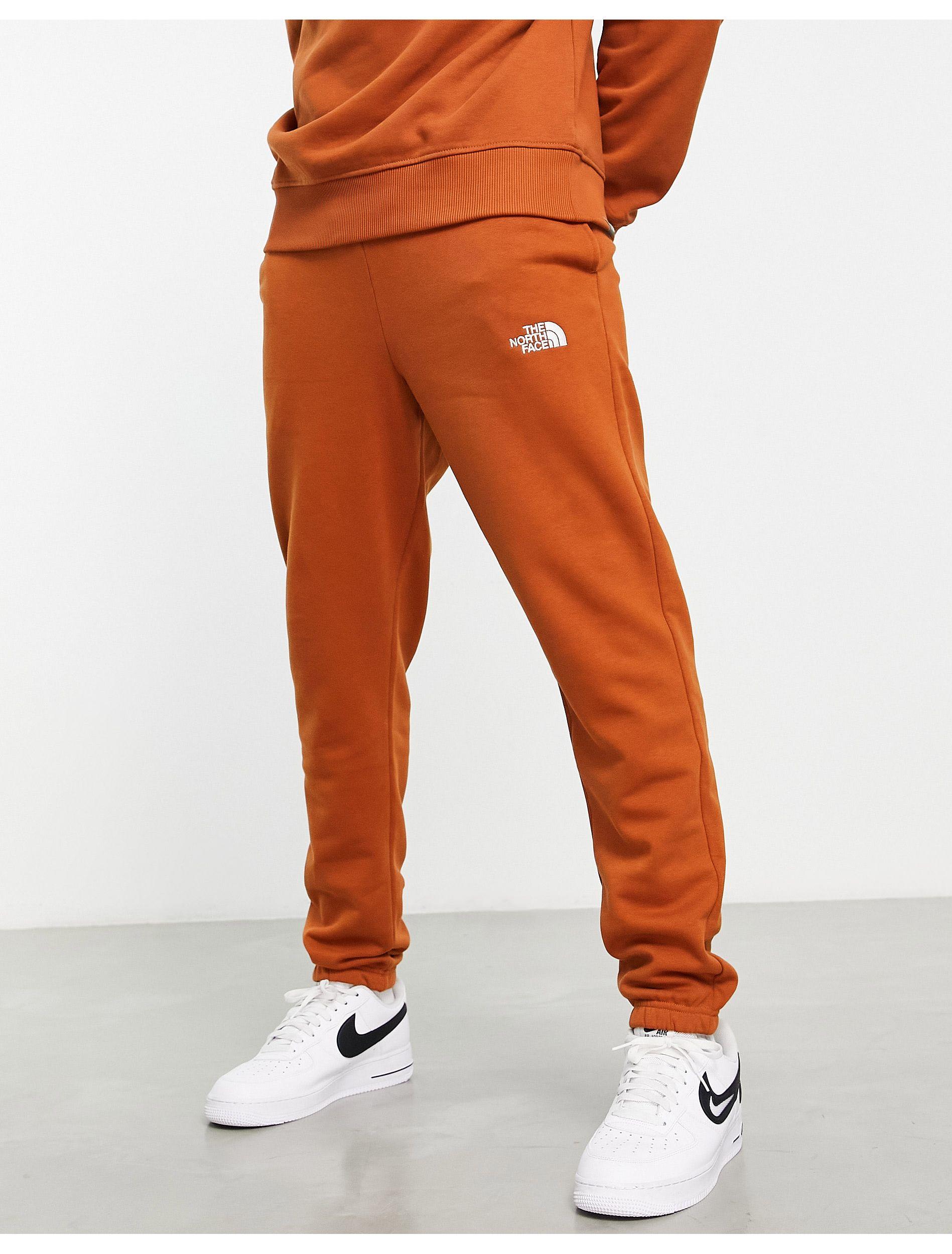 The North Face Essential jogger in Orange for Men | Lyst