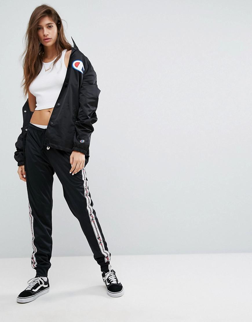 champion tracksuit bottoms with logo taping