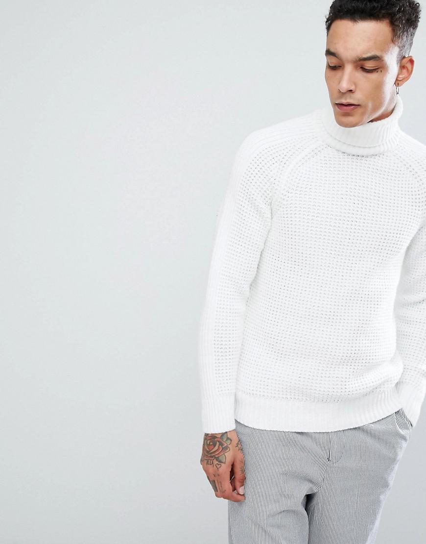 white polo neck sweater