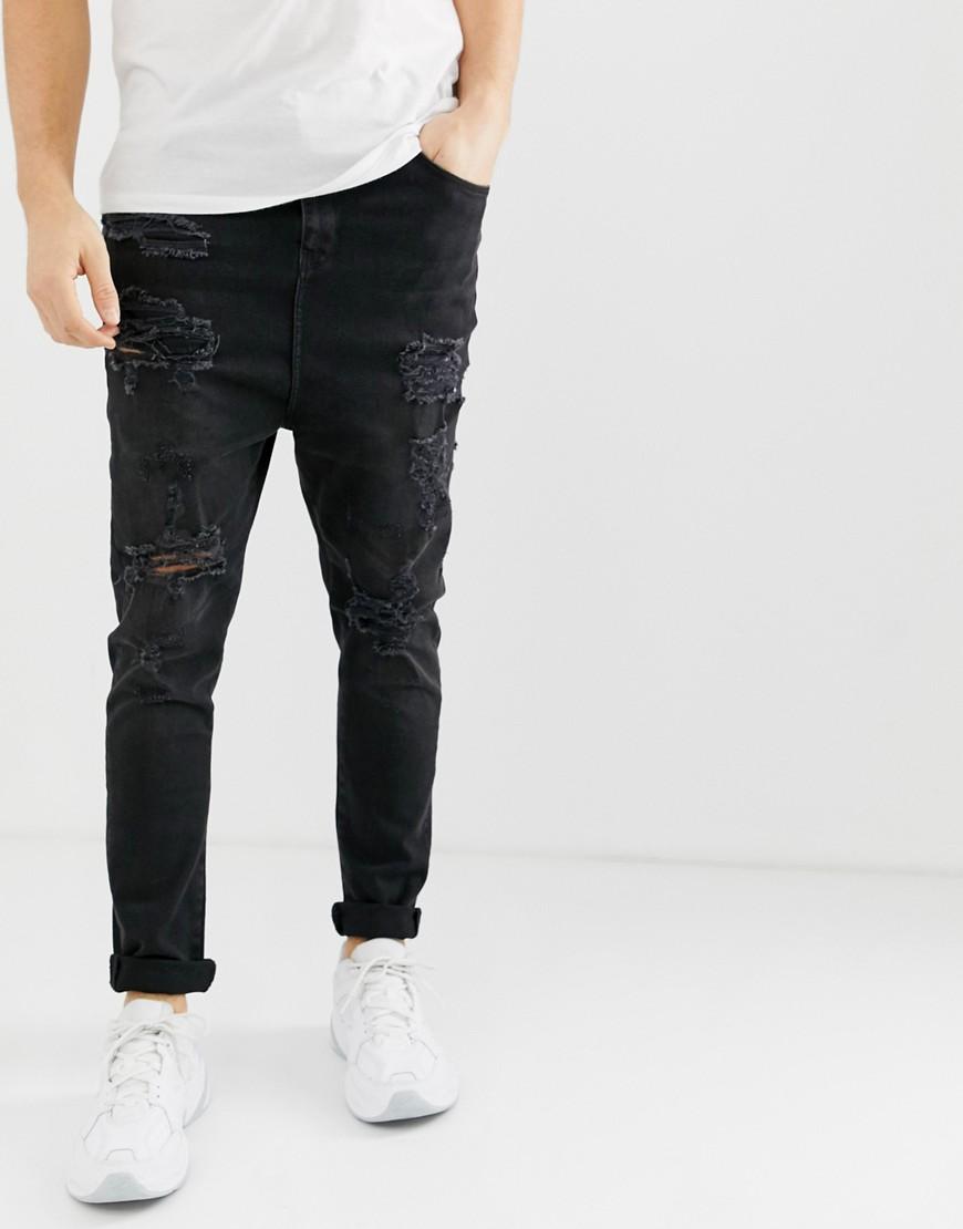 Jeans nero slavato con cavallo basso e strappiASOS in Denim da Uomo colore  Nero | Lyst