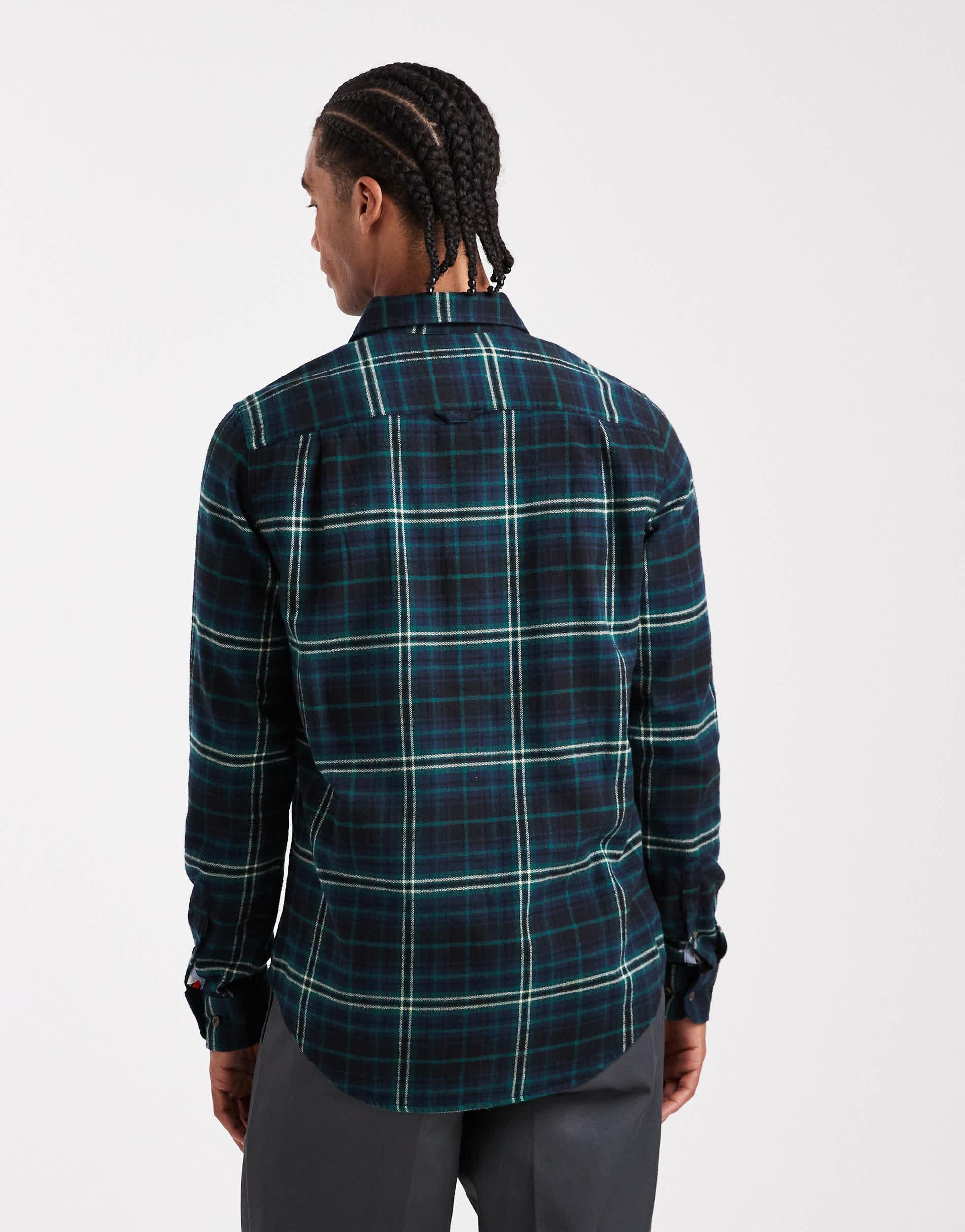 Chemise courte en coton bleu-vert à ourlet tombant et poche