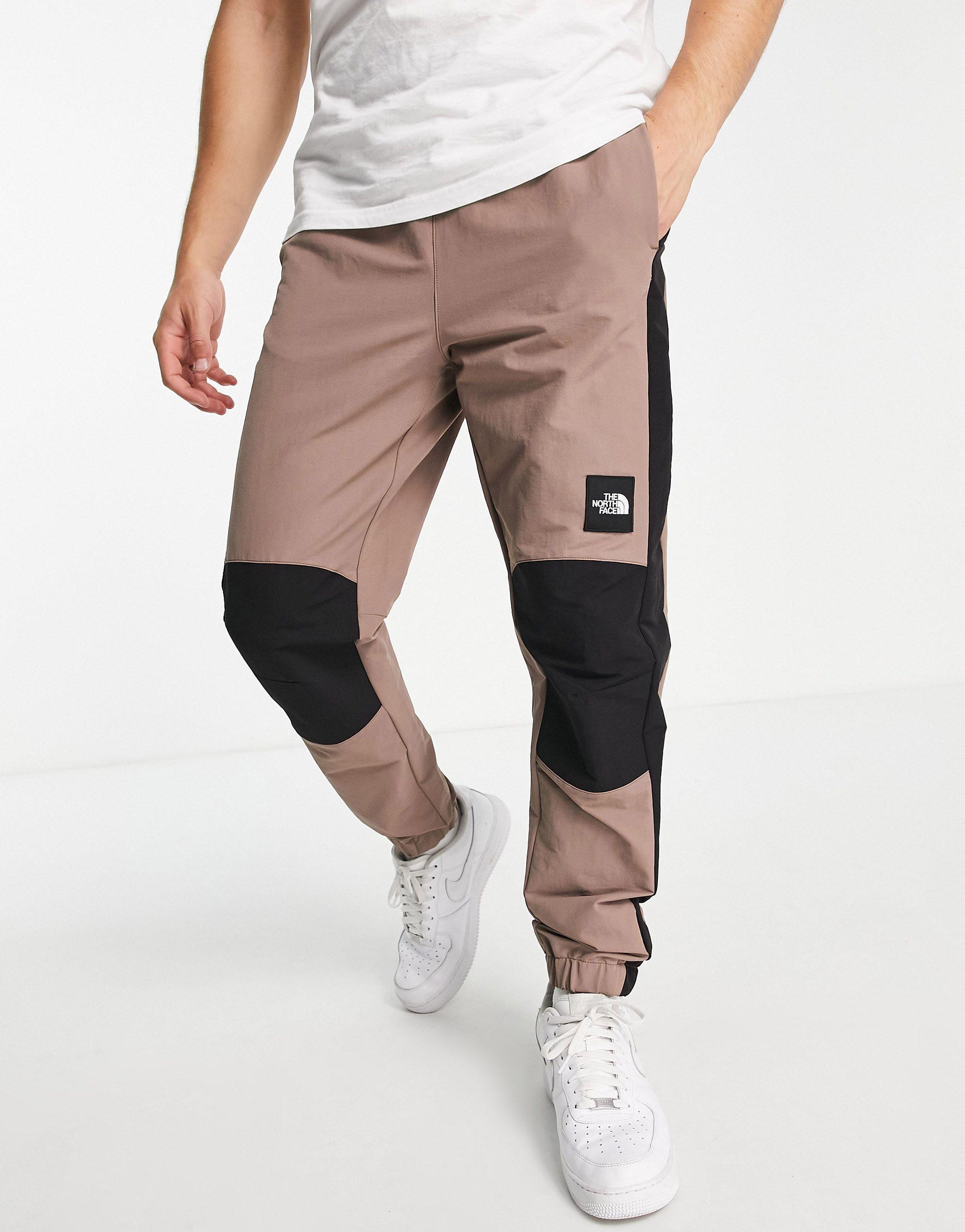 The North Face Phlego Dryvent Woven Track joggers in Natural for Men | Lyst