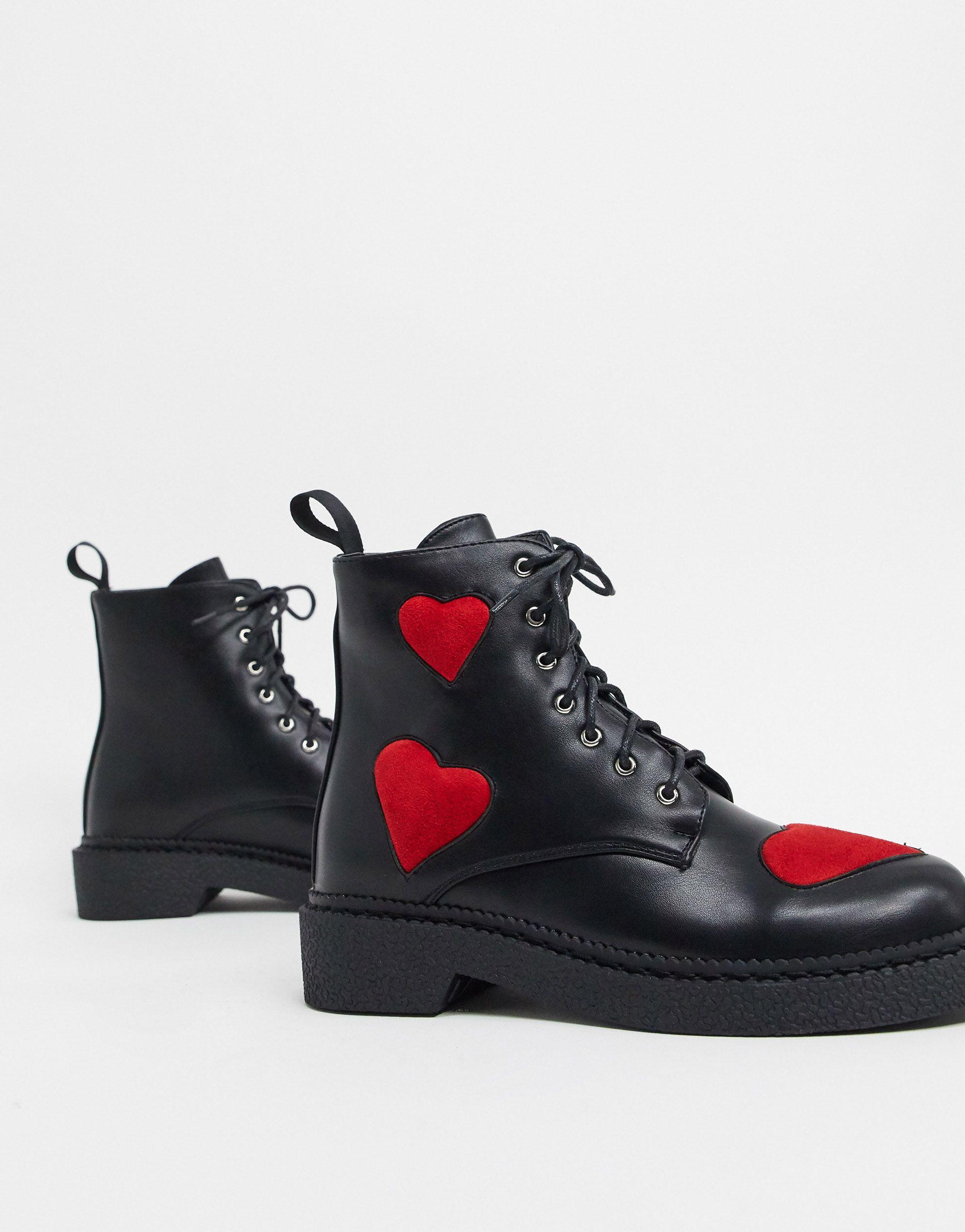 black boots with red hearts