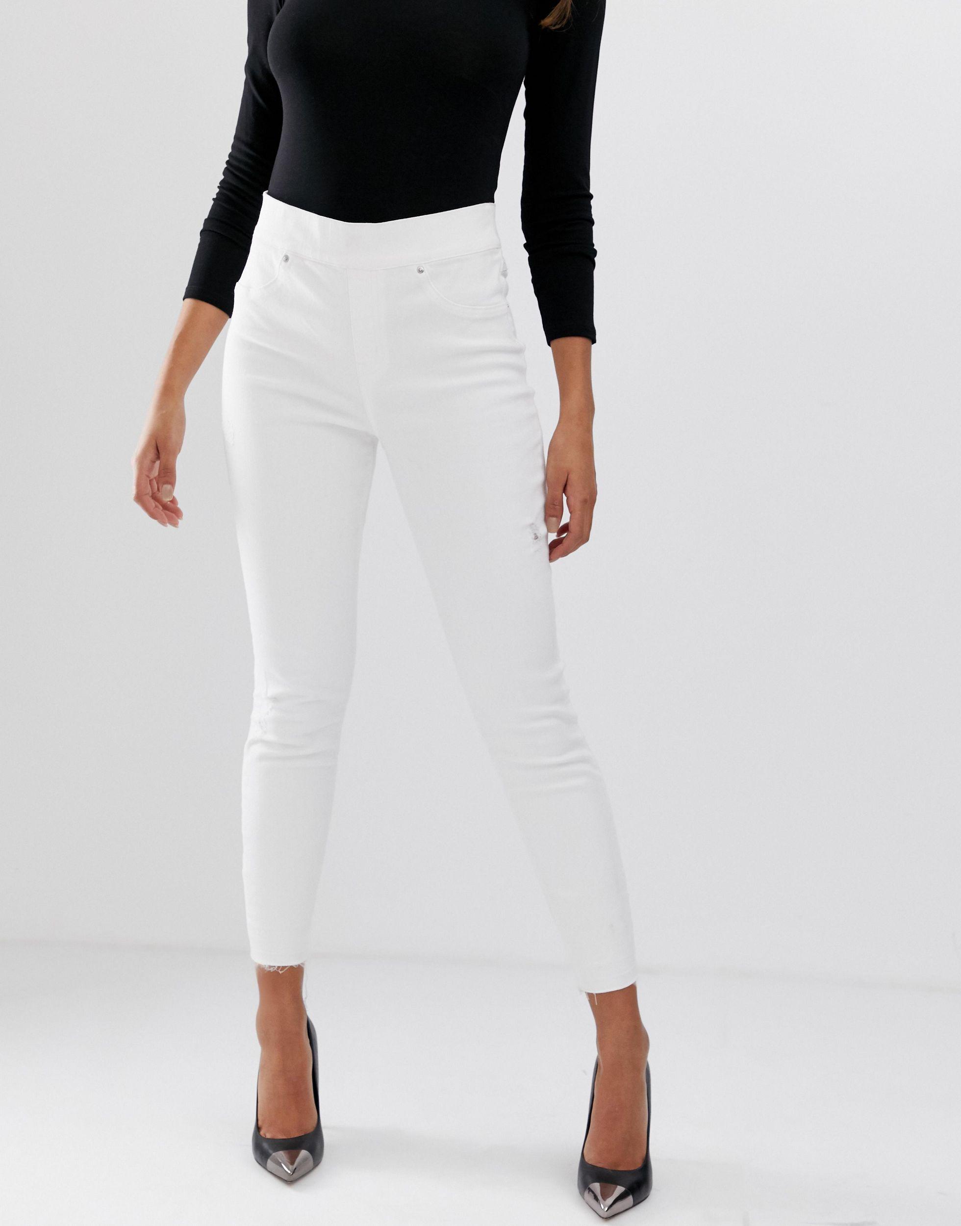 Spanx Shape And Lift Distressed Skinny Jeans in White | Lyst