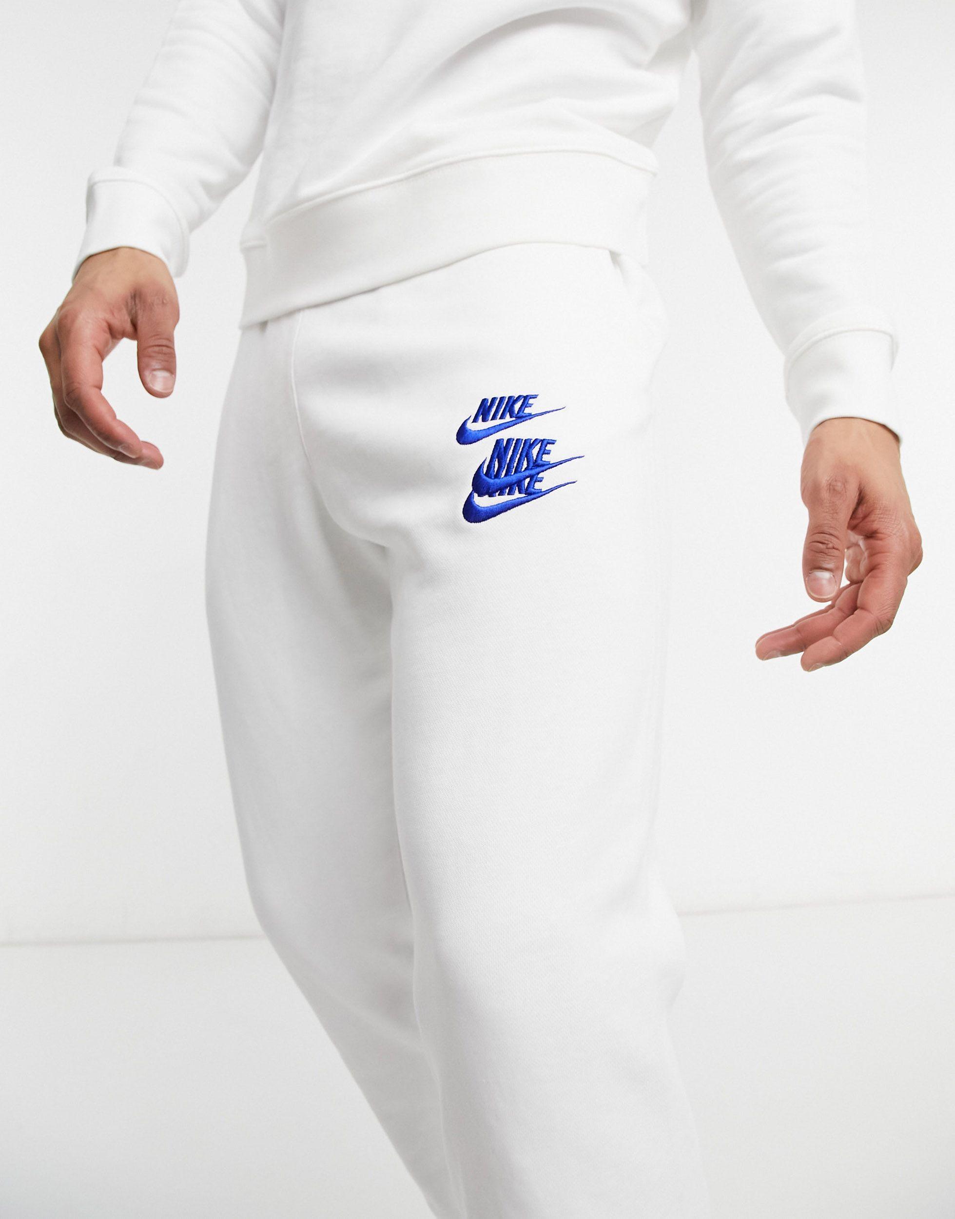 Nike World Tour Pack Graphic Cuffed joggers in White for Men | Lyst