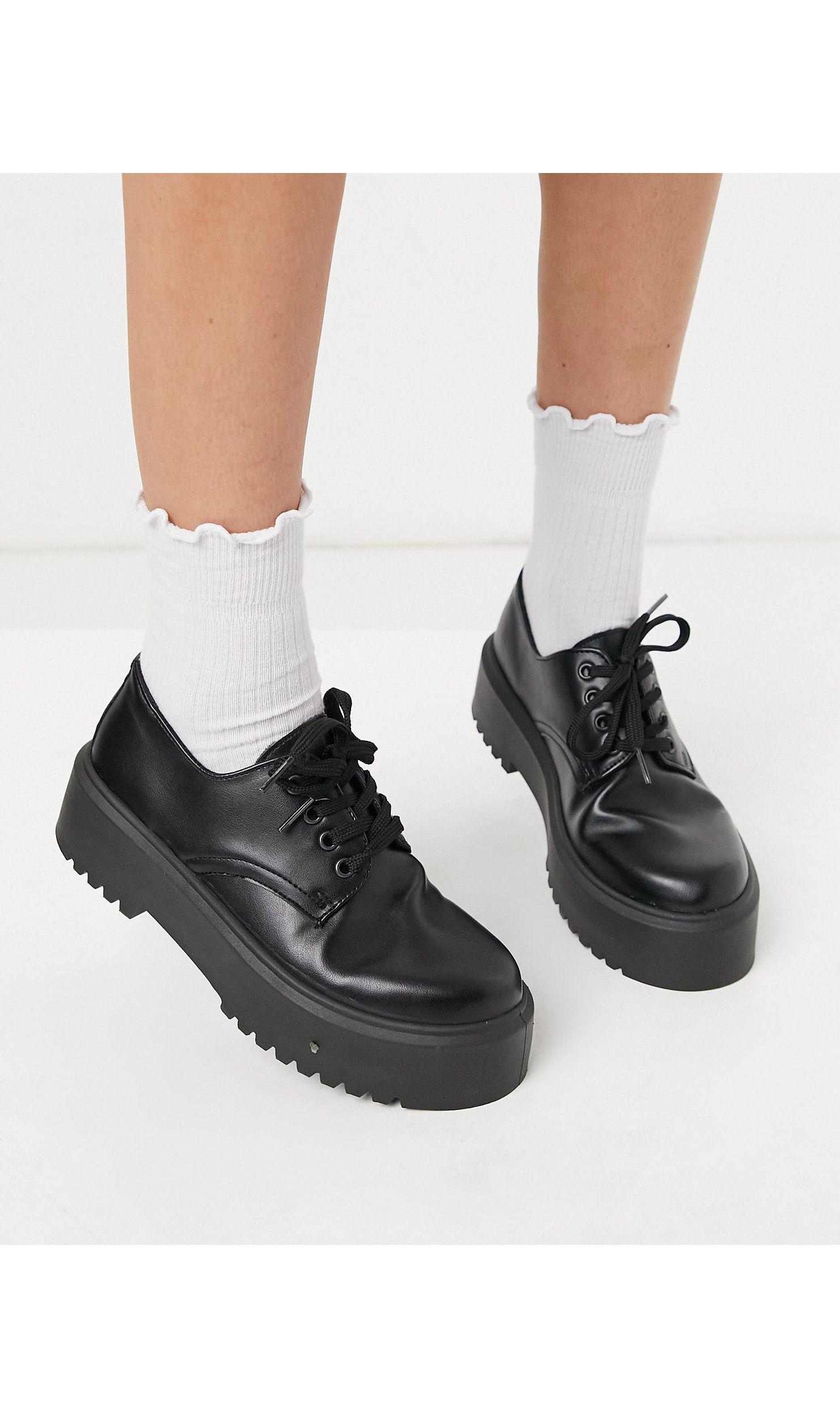 black chunky flat shoes