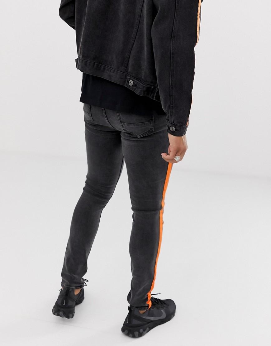 black jeans with orange stripe