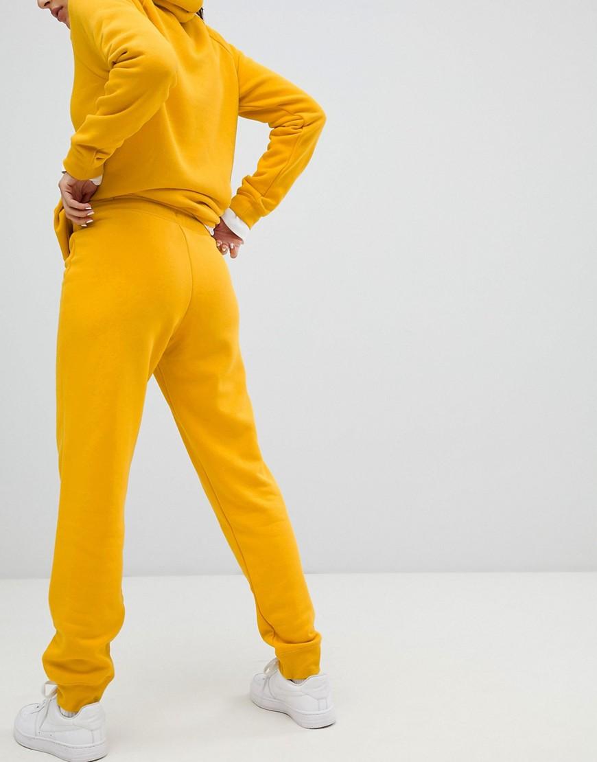Nike Katoen Rally - Gele Swoosh Logo joggingbroek in het Geel | Lyst NL