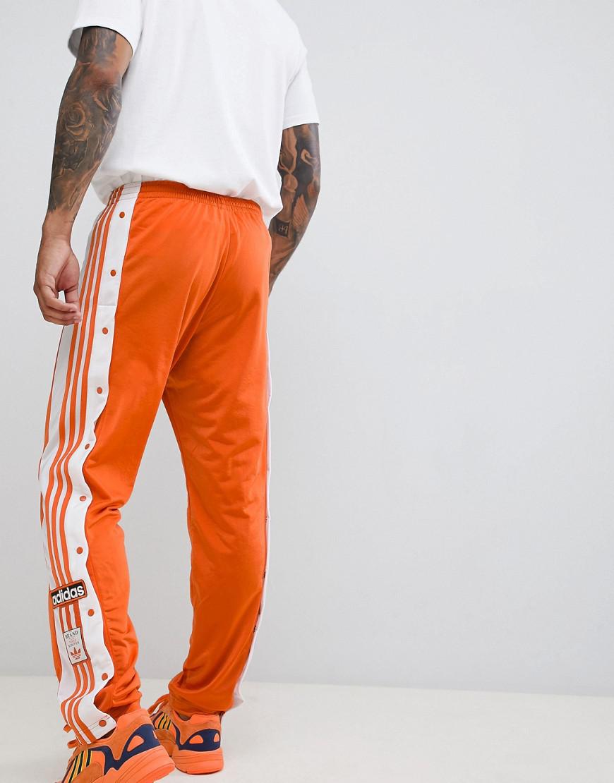 orange adidas joggers