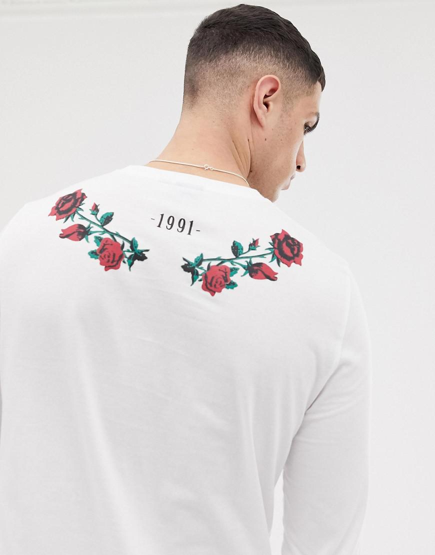 white shirt with red roses