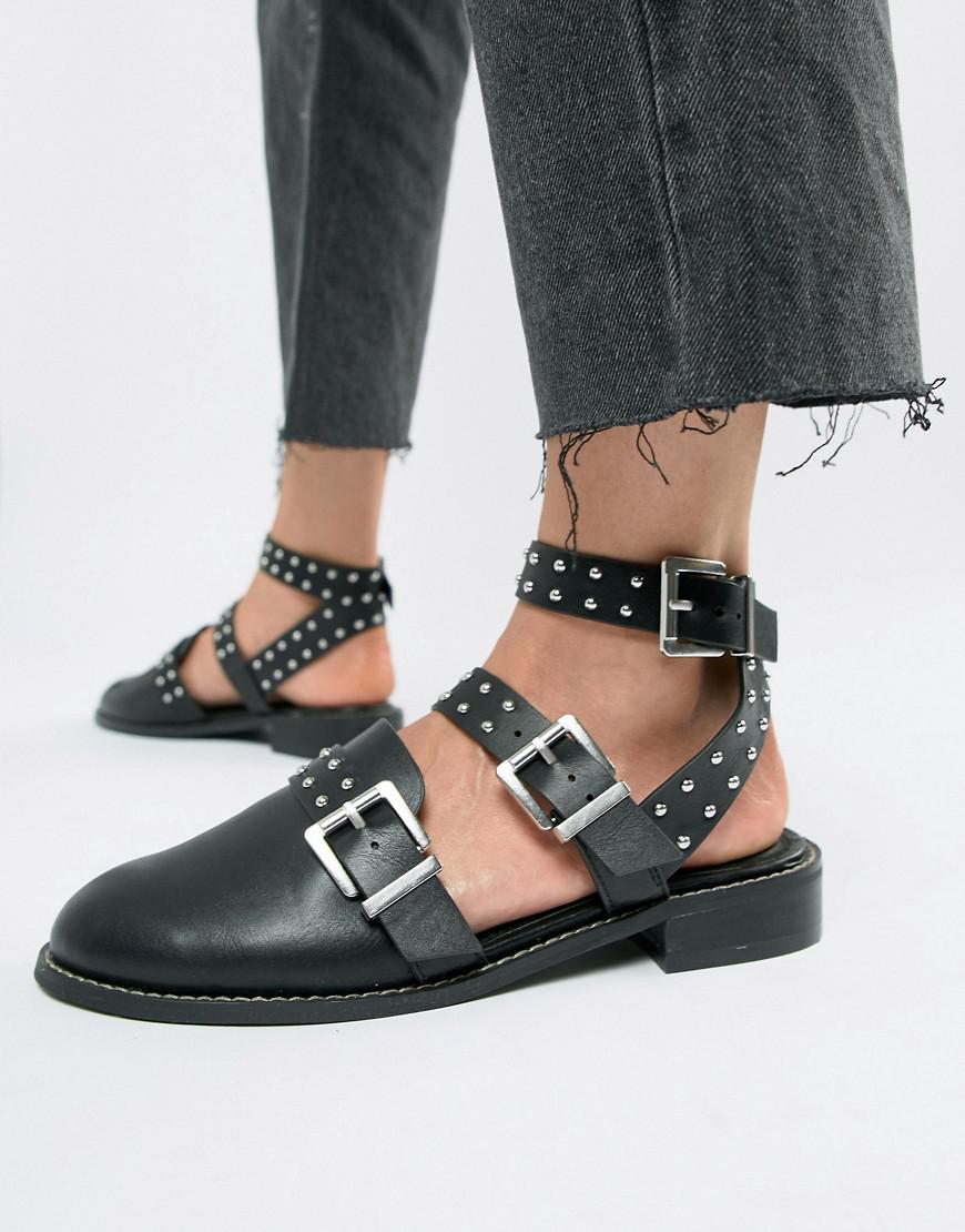 black studded flat shoes