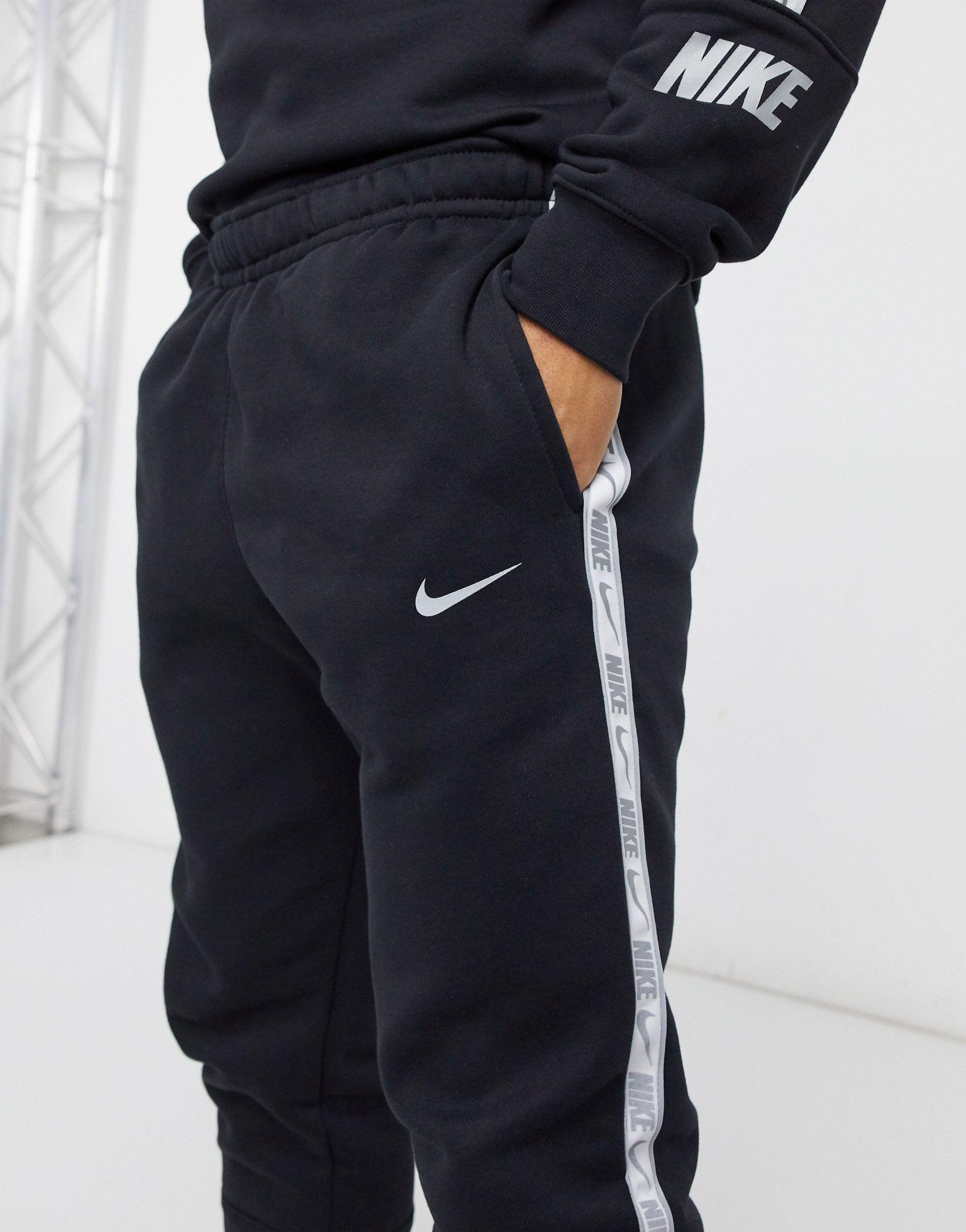 Nike club essentials panelled cuffed joggers in black Clearance