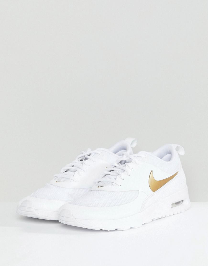 white & gold air max thea trainers