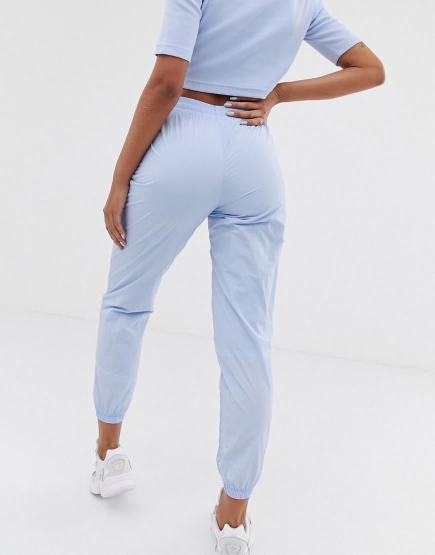 adidas Originals Synthetisch Ryv - Joggingbroek Met Hoge Taille En Streep  In Lichtblauw in het Blauw - Lyst