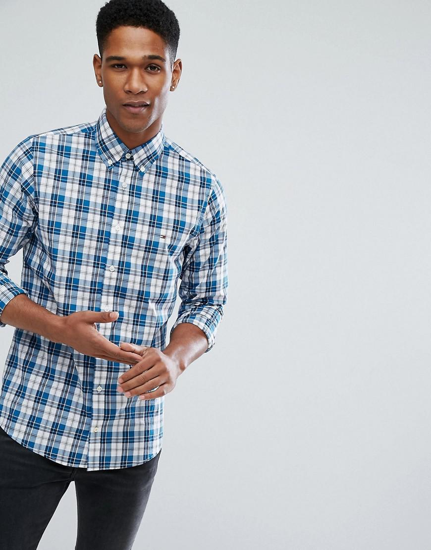 blue check shirt with black pants