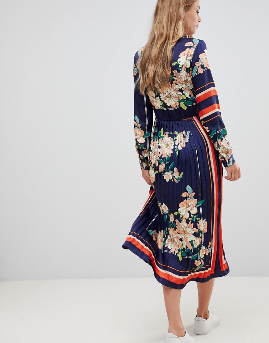 navy dress with pleated skirt