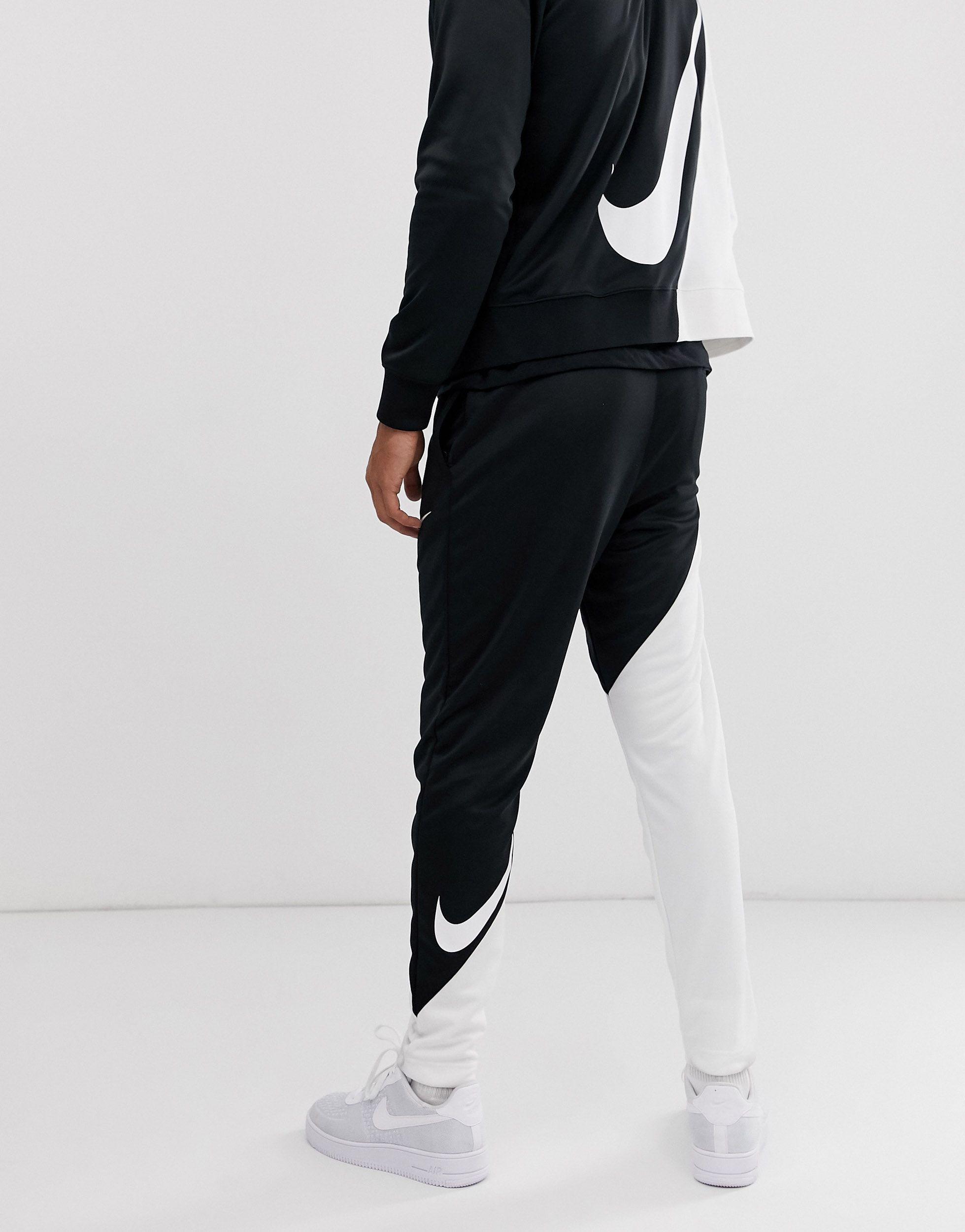 nike contrast stripe cuffed joggers in black