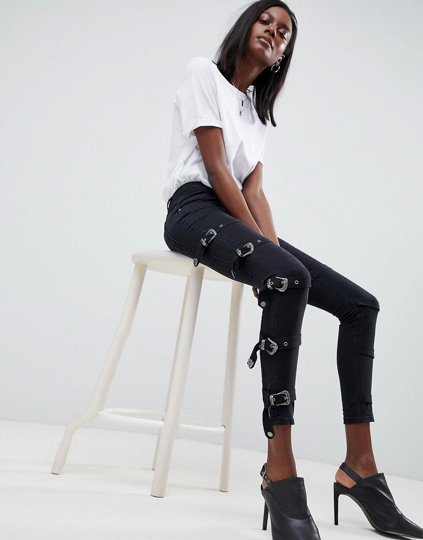 black jeans with buckles