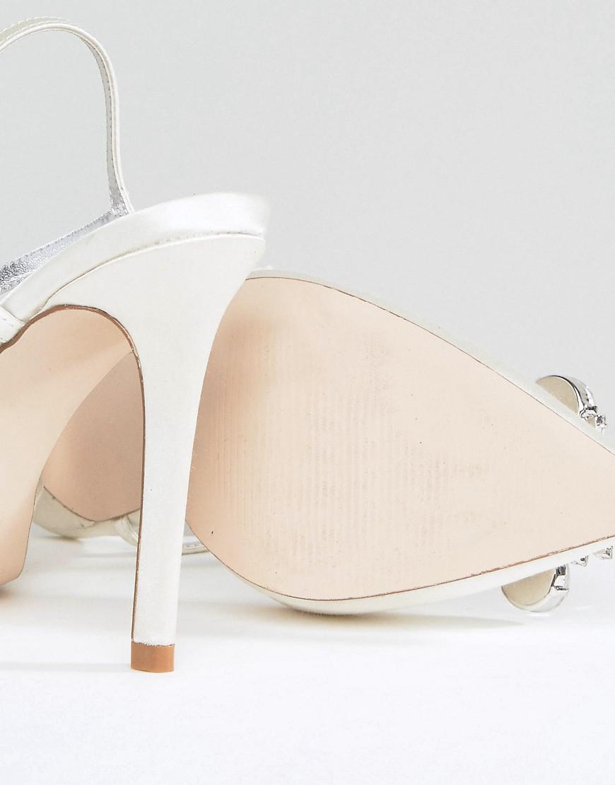 white pointed high heels