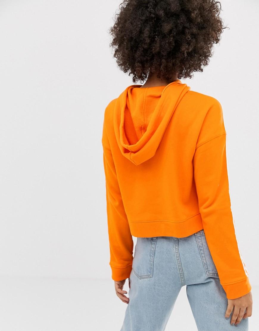 adidas originals three stripe sweatshirt in orange