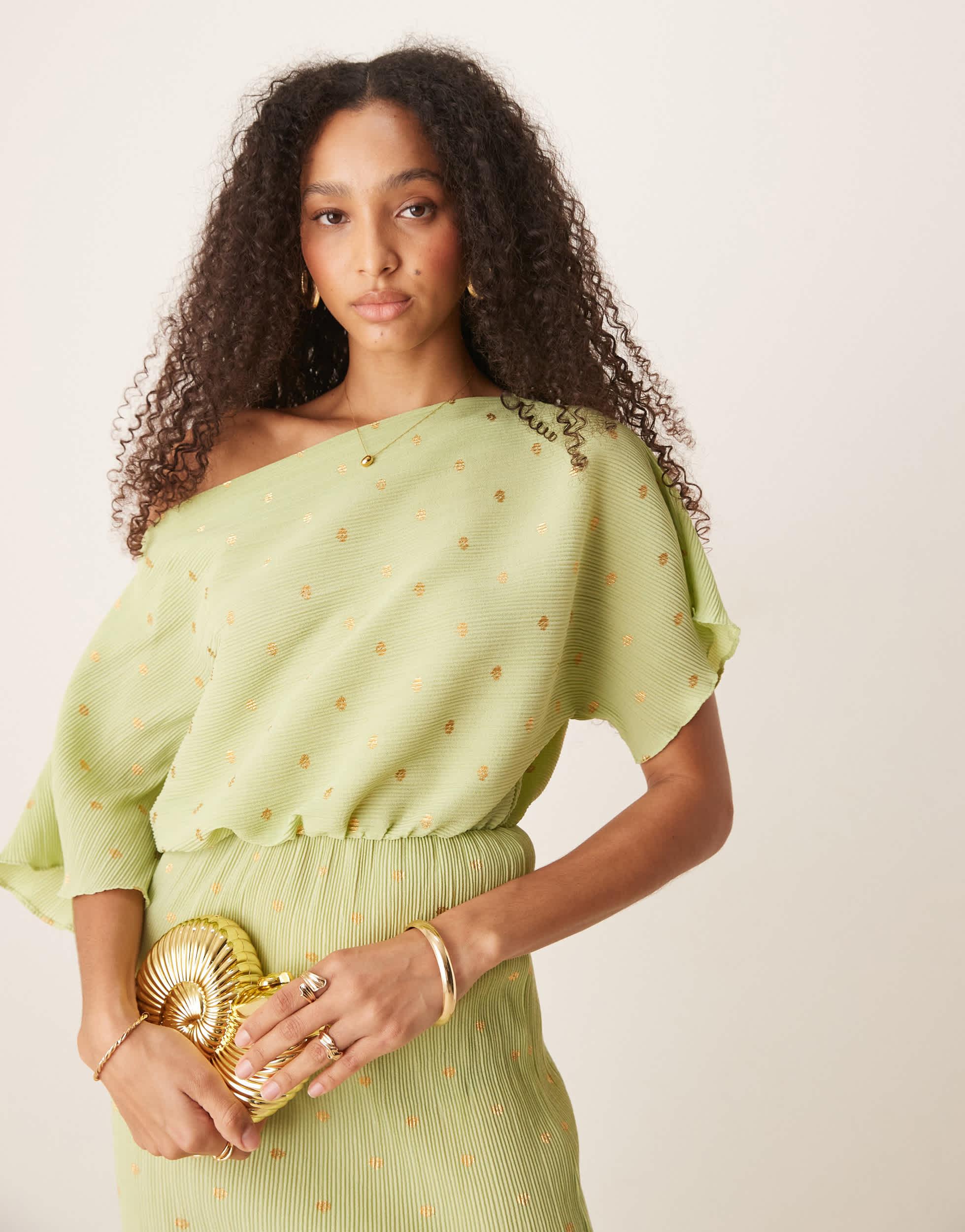 never fully dressed gold plisse dress The gold plisse luna dress  Available at Neverfullydressed.com   #summerfashion #multiwear #multiway #plisse #howtotie