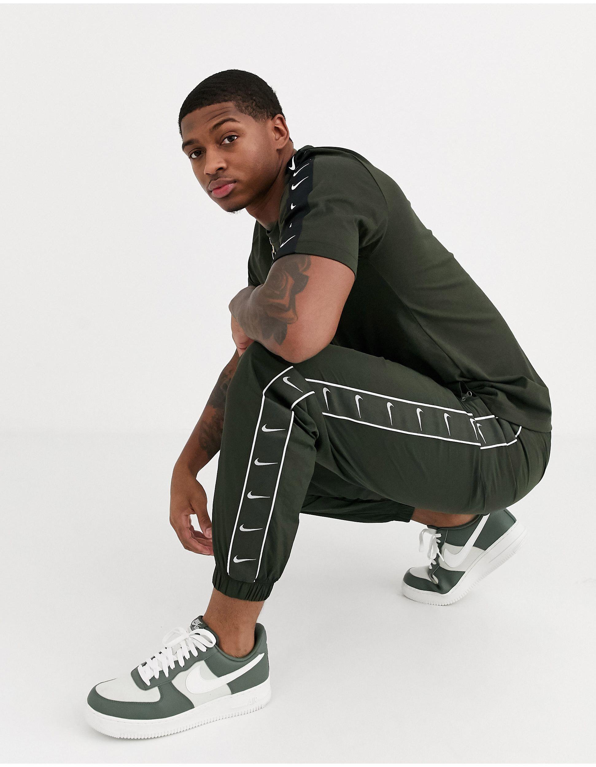 Jogger a logo virgule avec chevilles resserrees et bandes Kaki Nike pour homme en coloris Vert Lyst