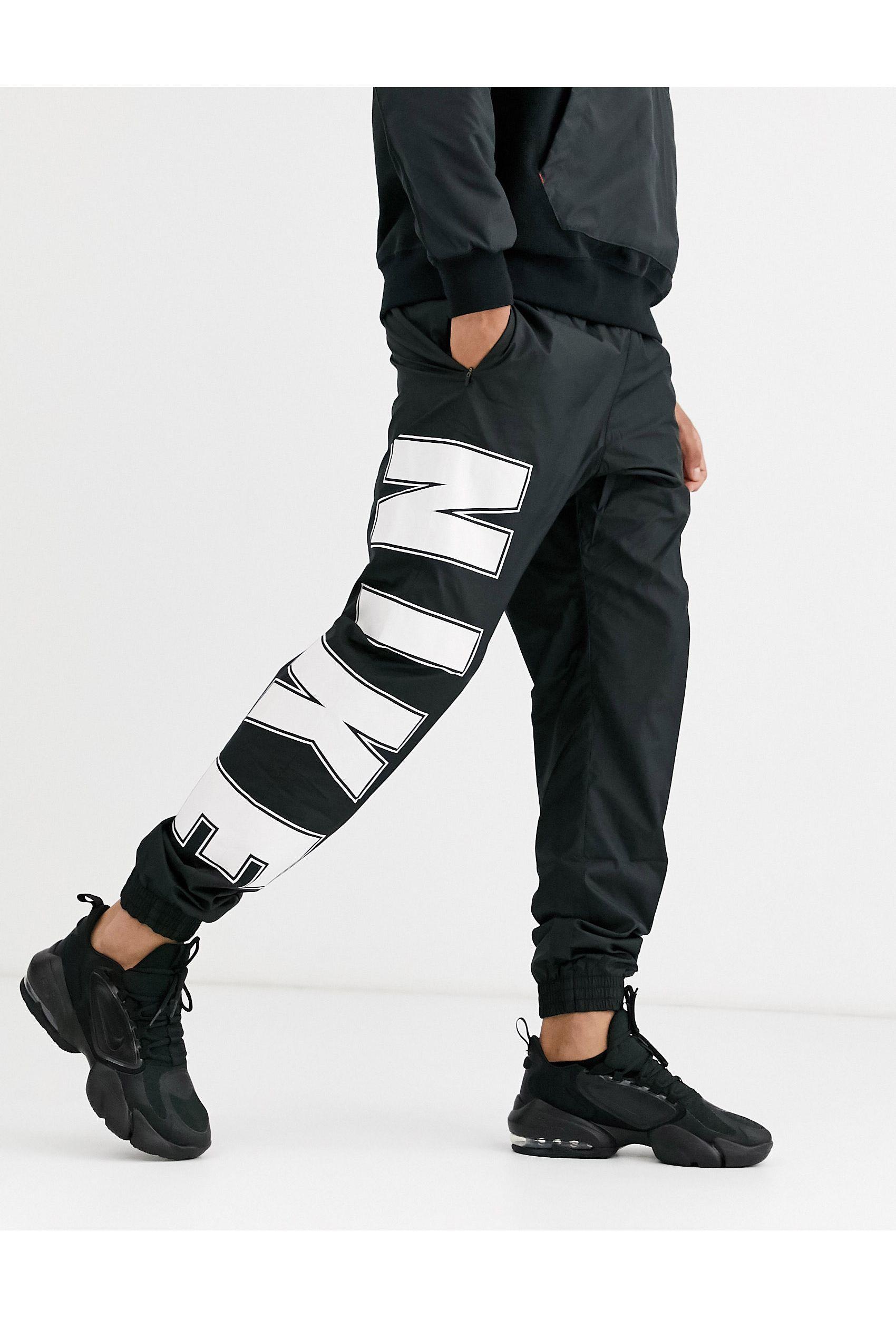 Nike Overbranded Cuffed joggers in Black for Men | Lyst UK