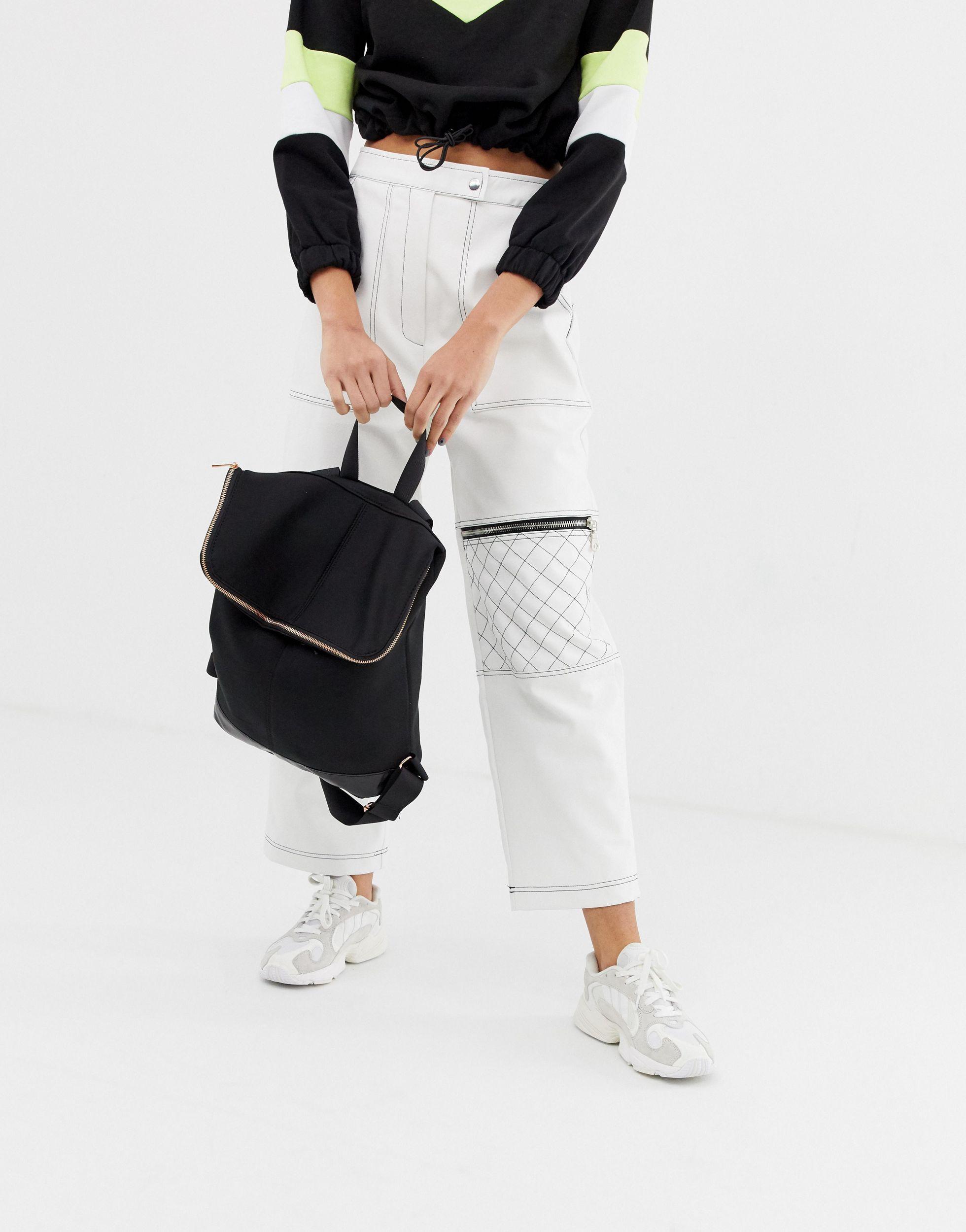 Black fold over backpack sale