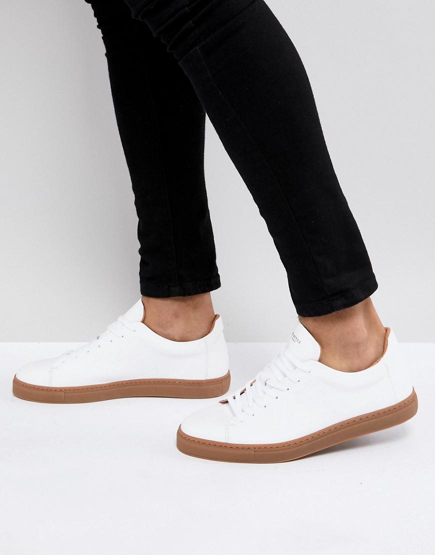 white leather sneakers with gum sole
