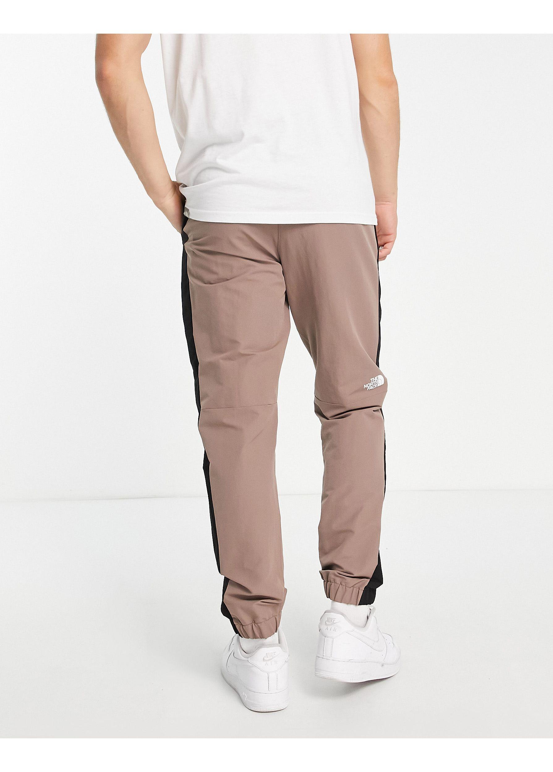 The North Face Phlego Dryvent Woven Track joggers in Natural for Men | Lyst  UK