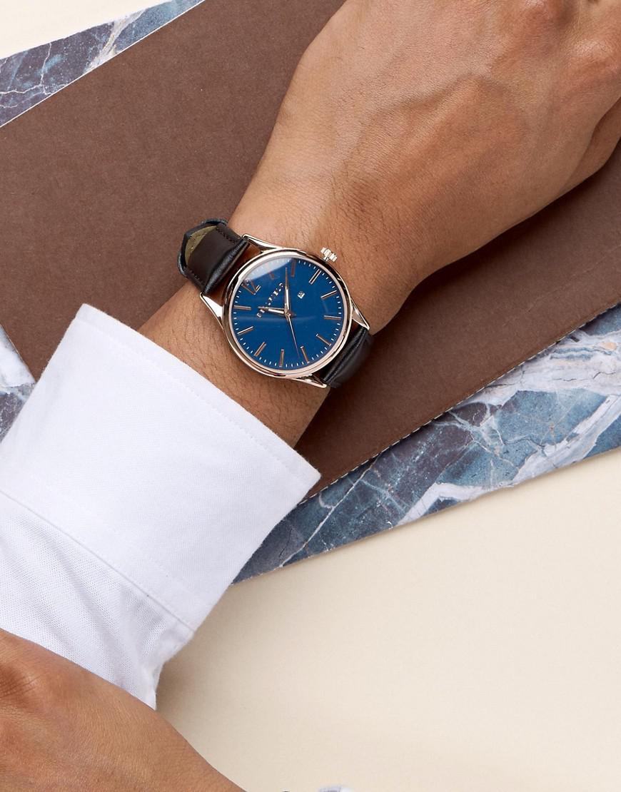 silver watch with blue dial