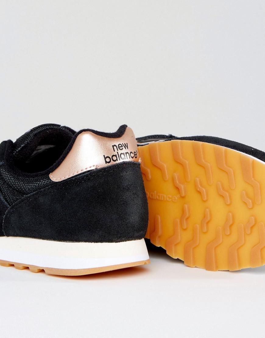 black and rose gold new balance trainers