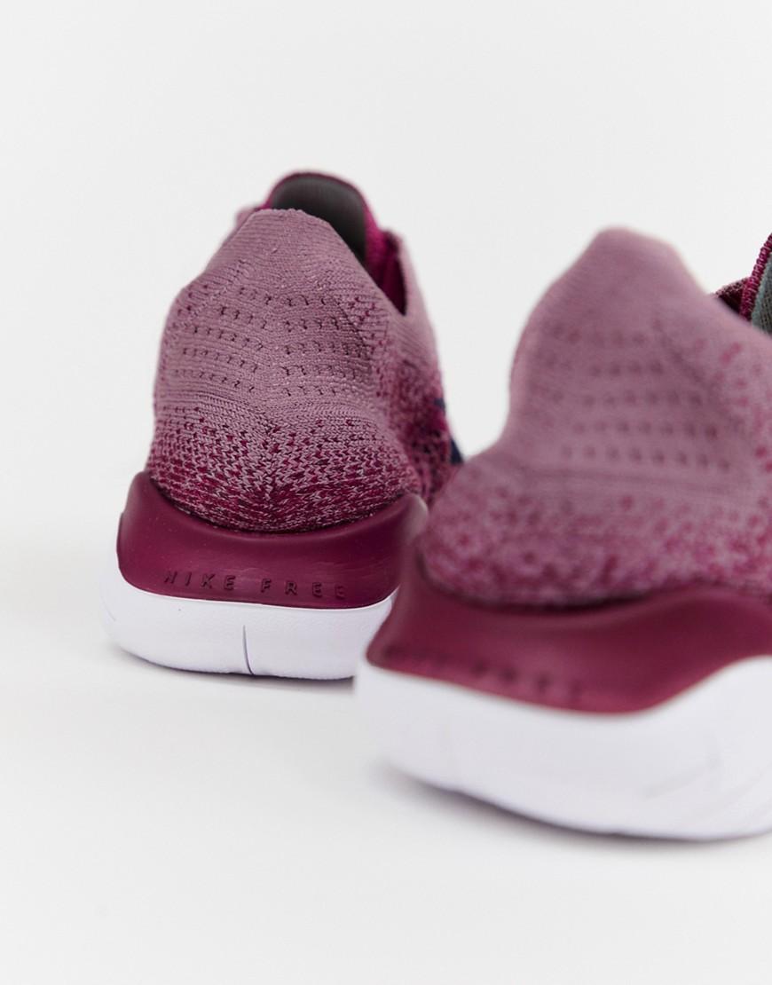 nike running free run flyknit trainers in berry