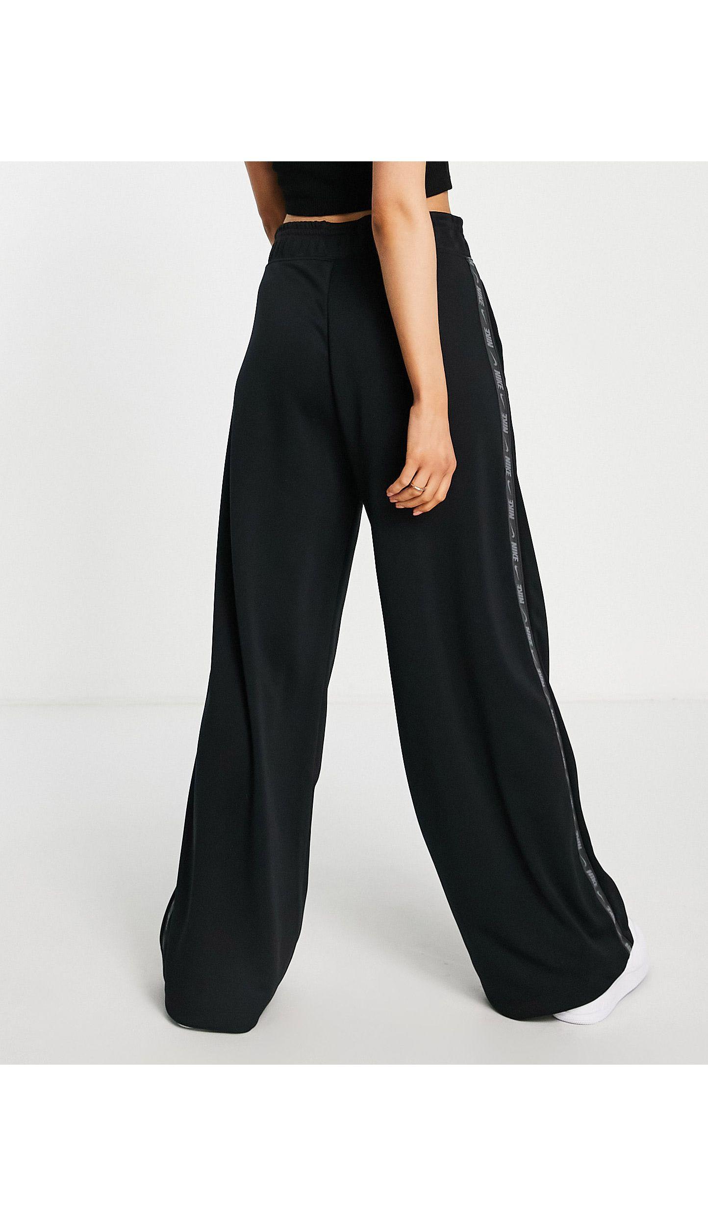 Nike Swoosh Tape Wide Leg joggers in Black | Lyst UK