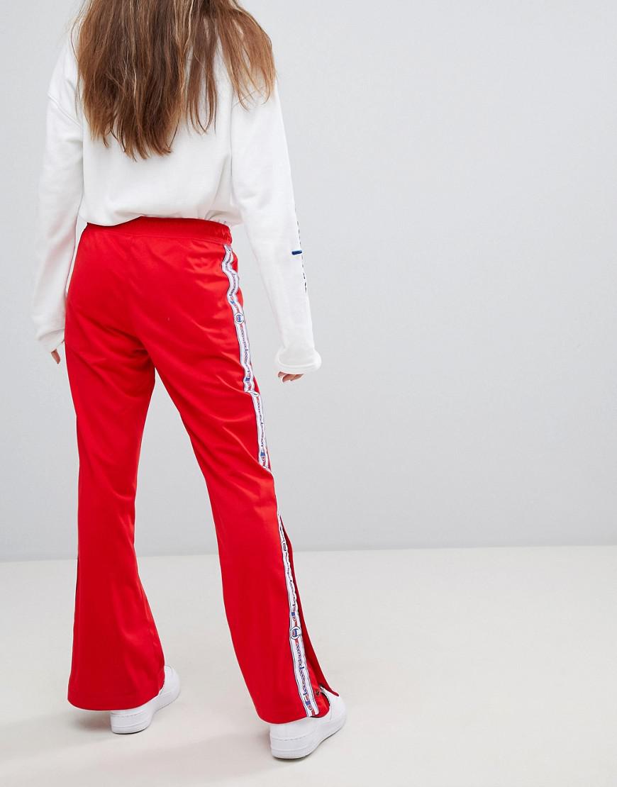 champion tracksuit bottoms with logo taping