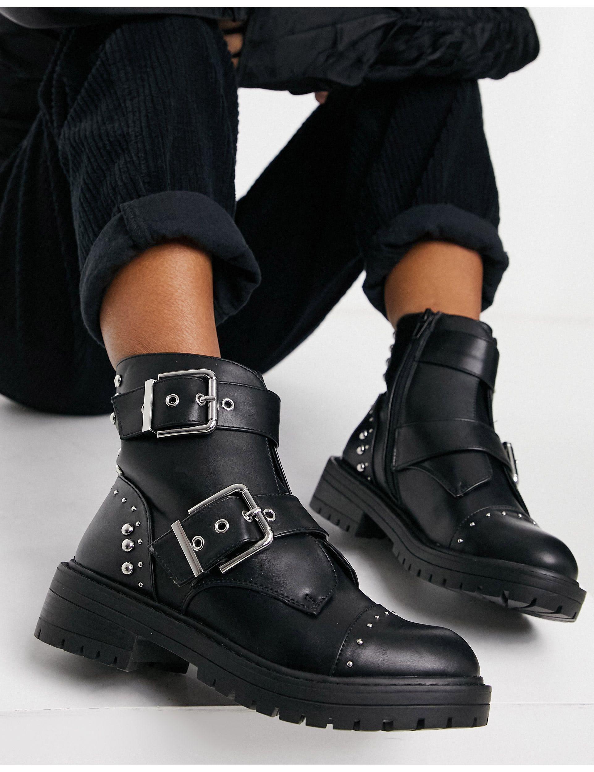 Mujer Zapatos de Botas de Botines Botines con detalle de hebilla DKNY de Cuero de color Negro 