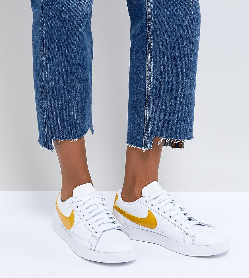 nike white and yellow trainers
