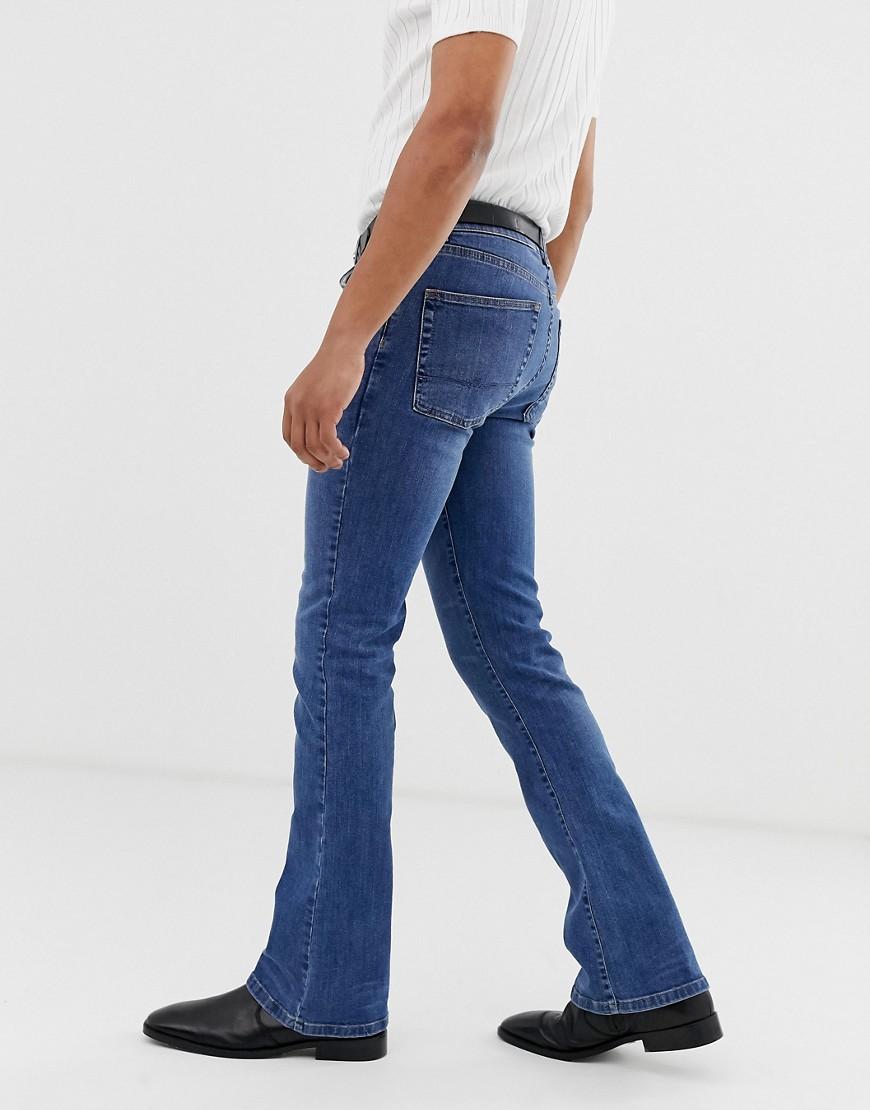 Rigid flare jeans in tinted mid wash ASOS Herren Kleidung Hosen & Jeans Jeans Bootcut Jeans 