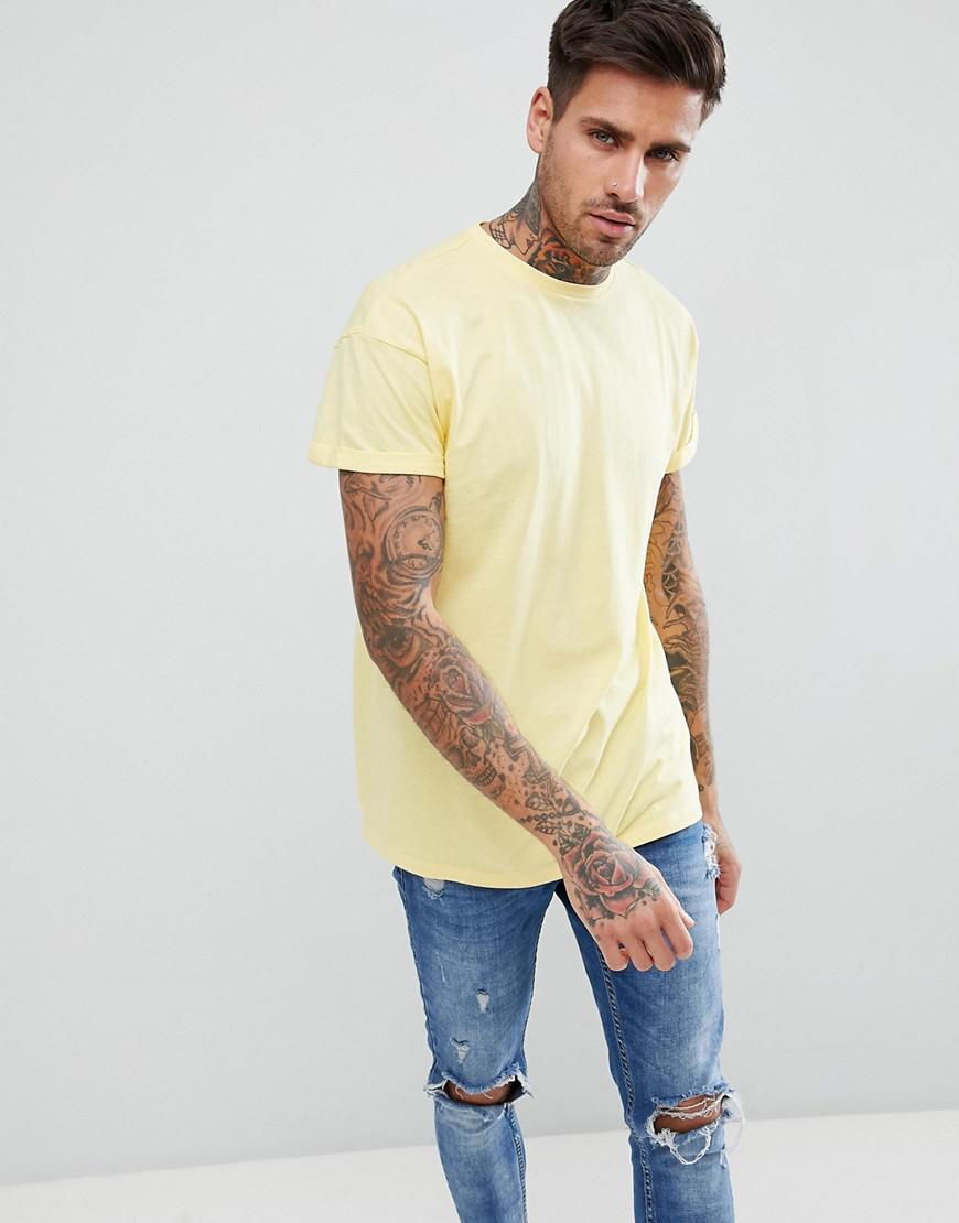 yellow shirt with light blue jeans