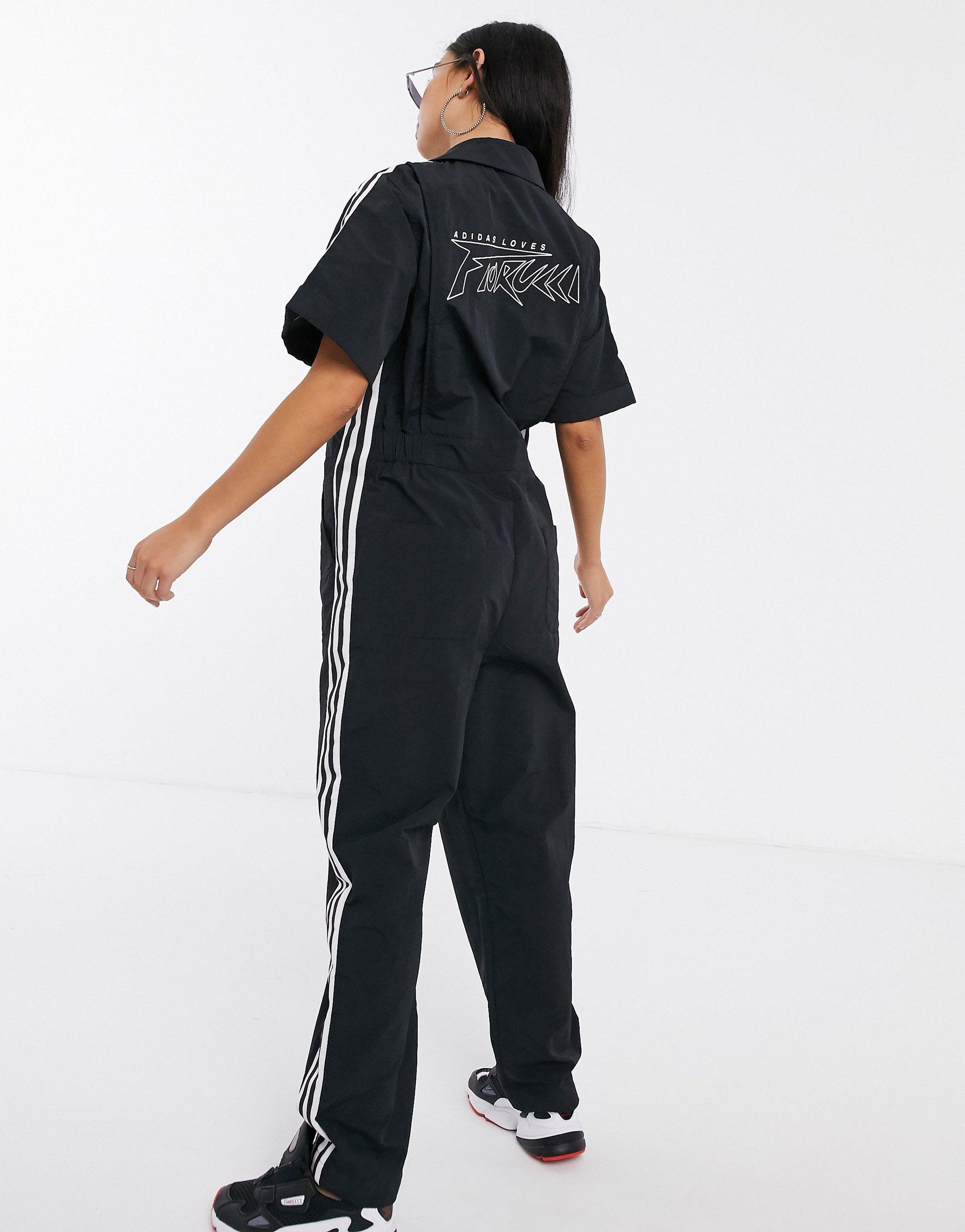 X Fiorucci - Tuta lunga nera con tre strisceadidas Originals in Materiale  sintetico di colore Nero | Lyst
