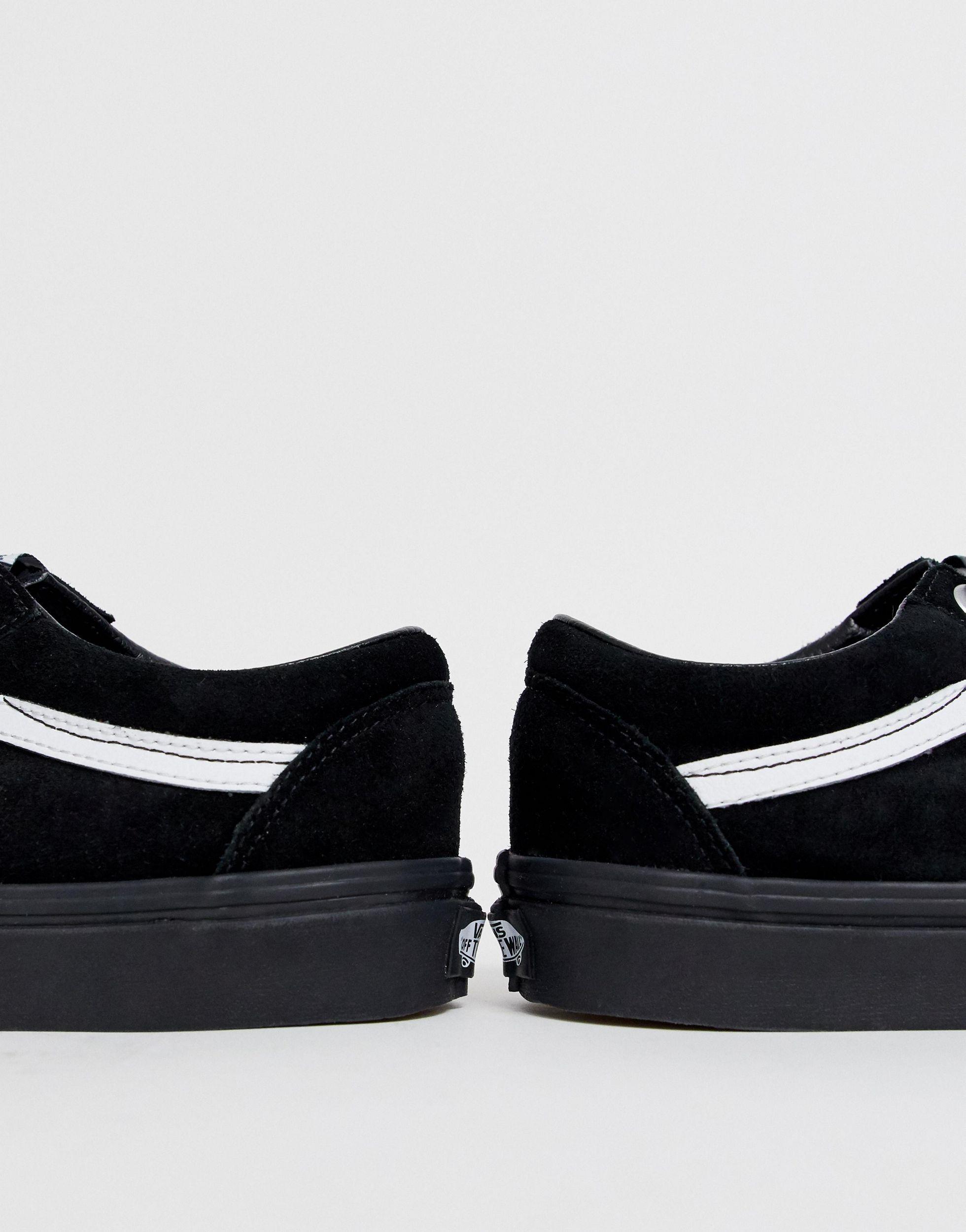 all black vans with white laces