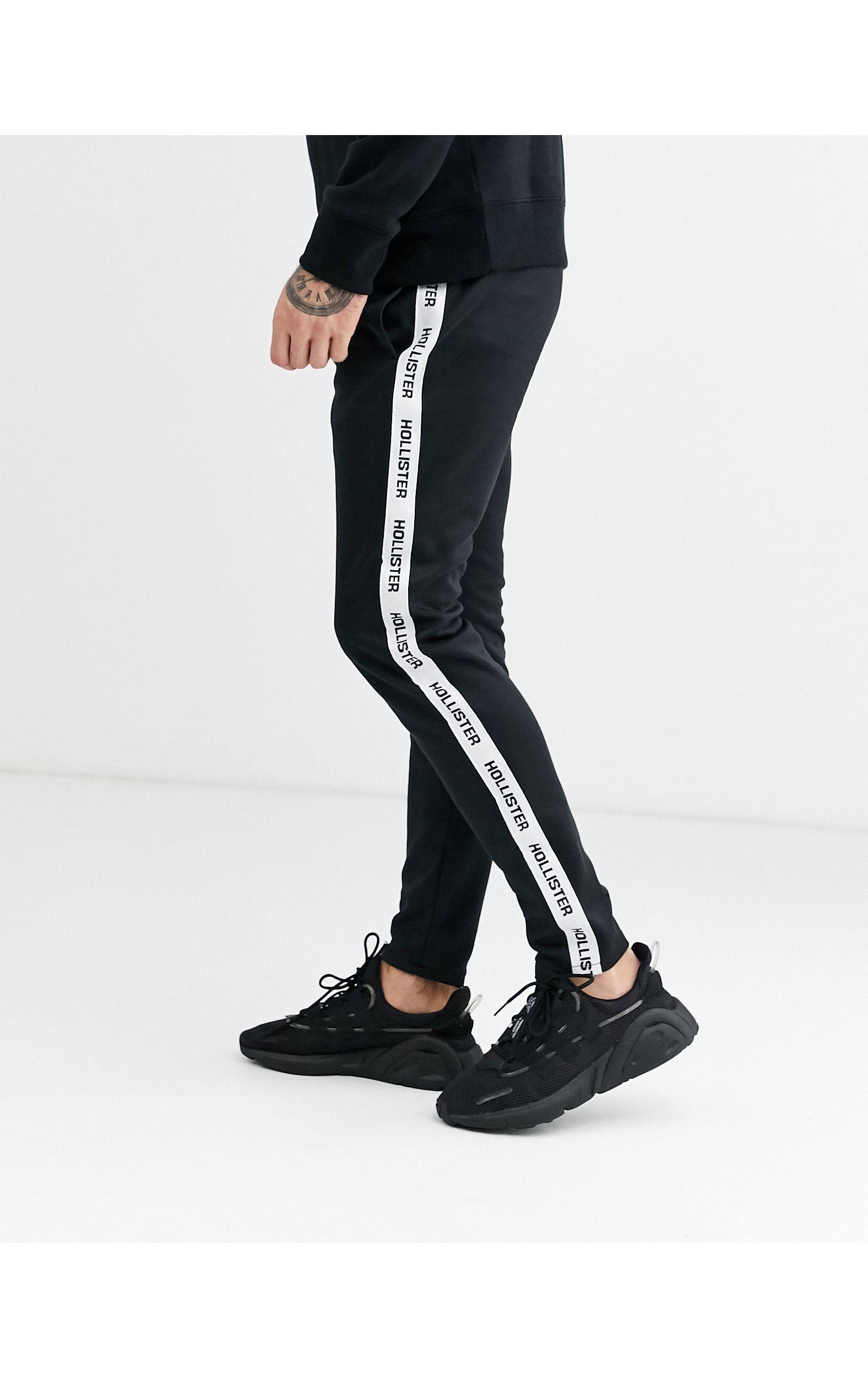 Hollister Icon Logo Side Tape Track joggers in Black for Men | Lyst