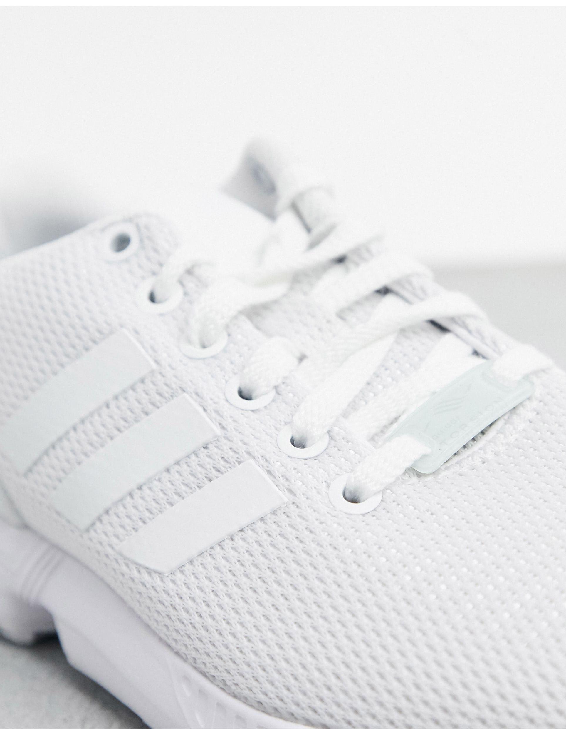 womens white adidas flux trainers